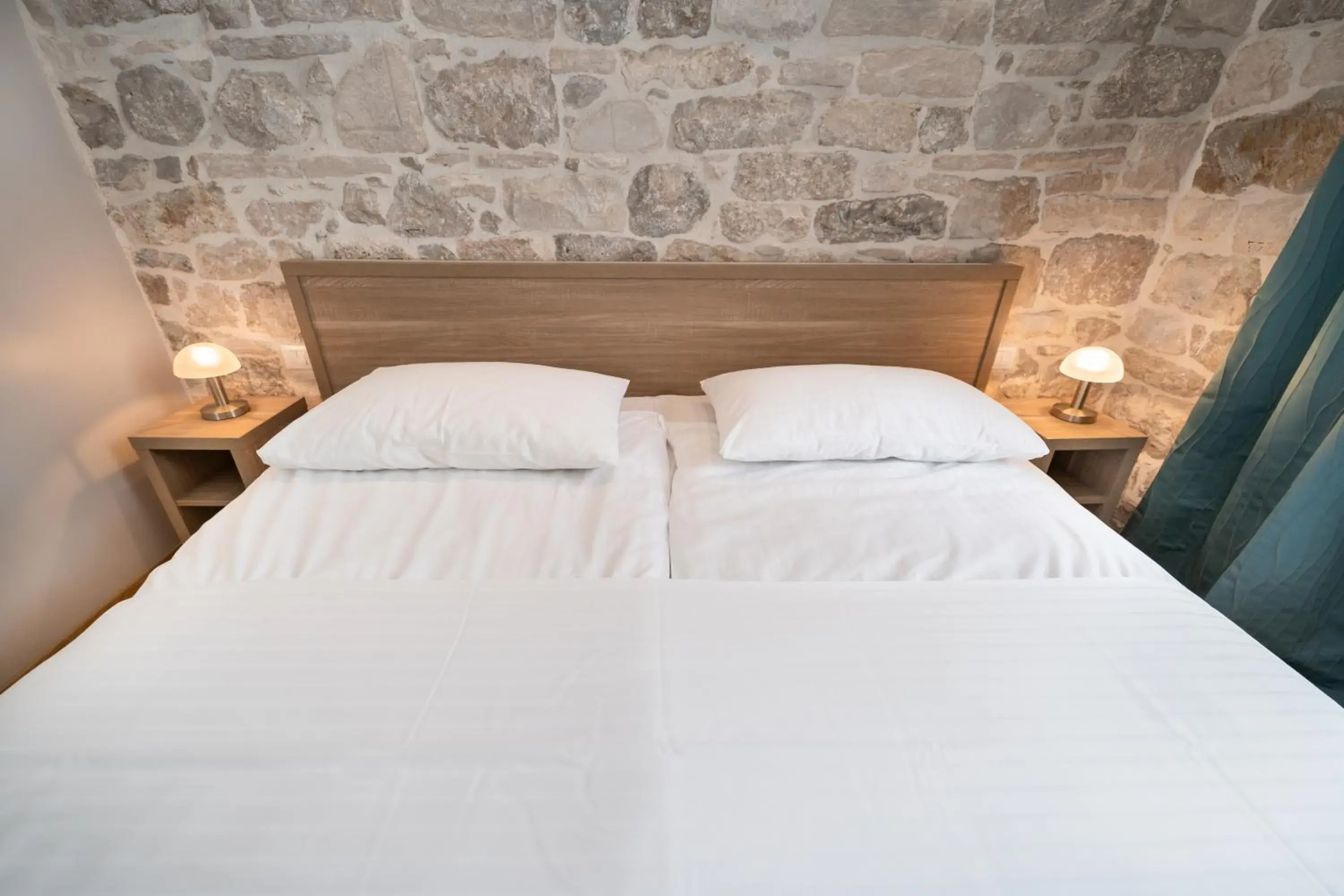 Bed in Tifani Luxury Rooms