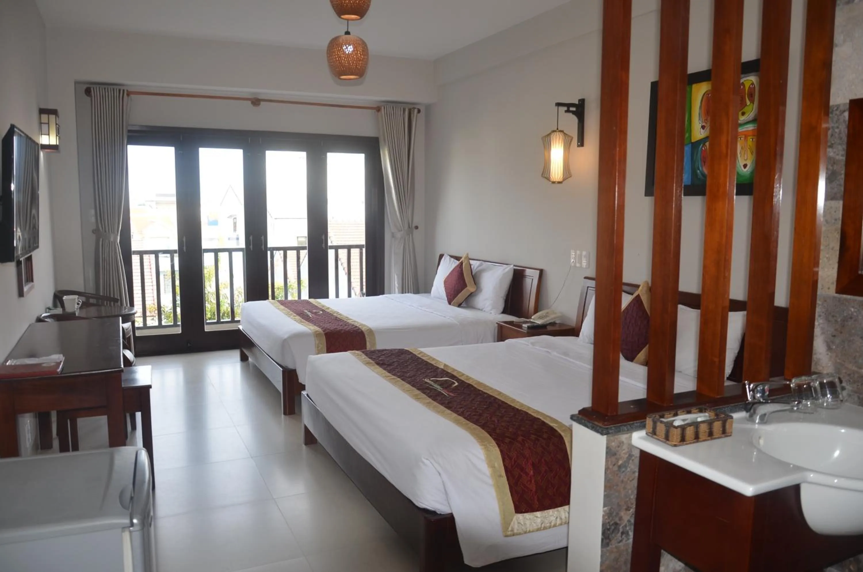 Bed in Sunshine Hoian Hotel