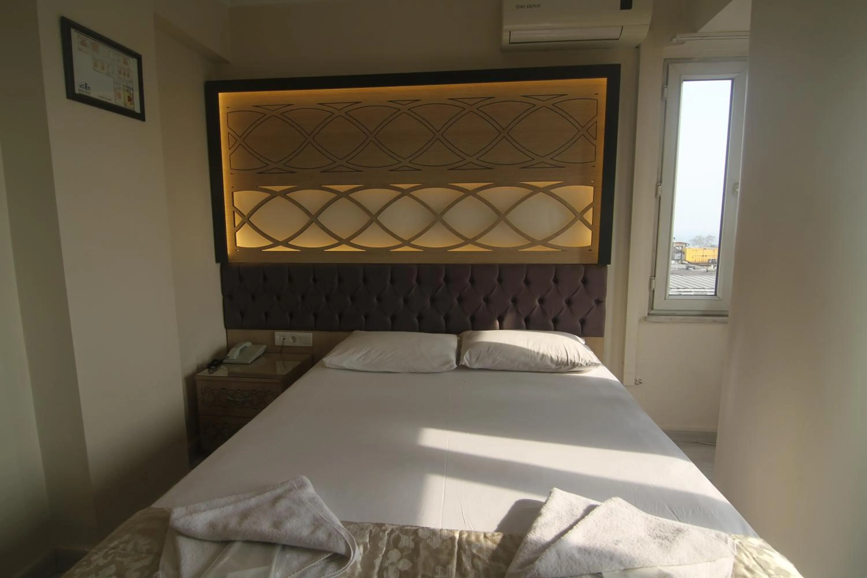 Bed in Grand Liza Hotel