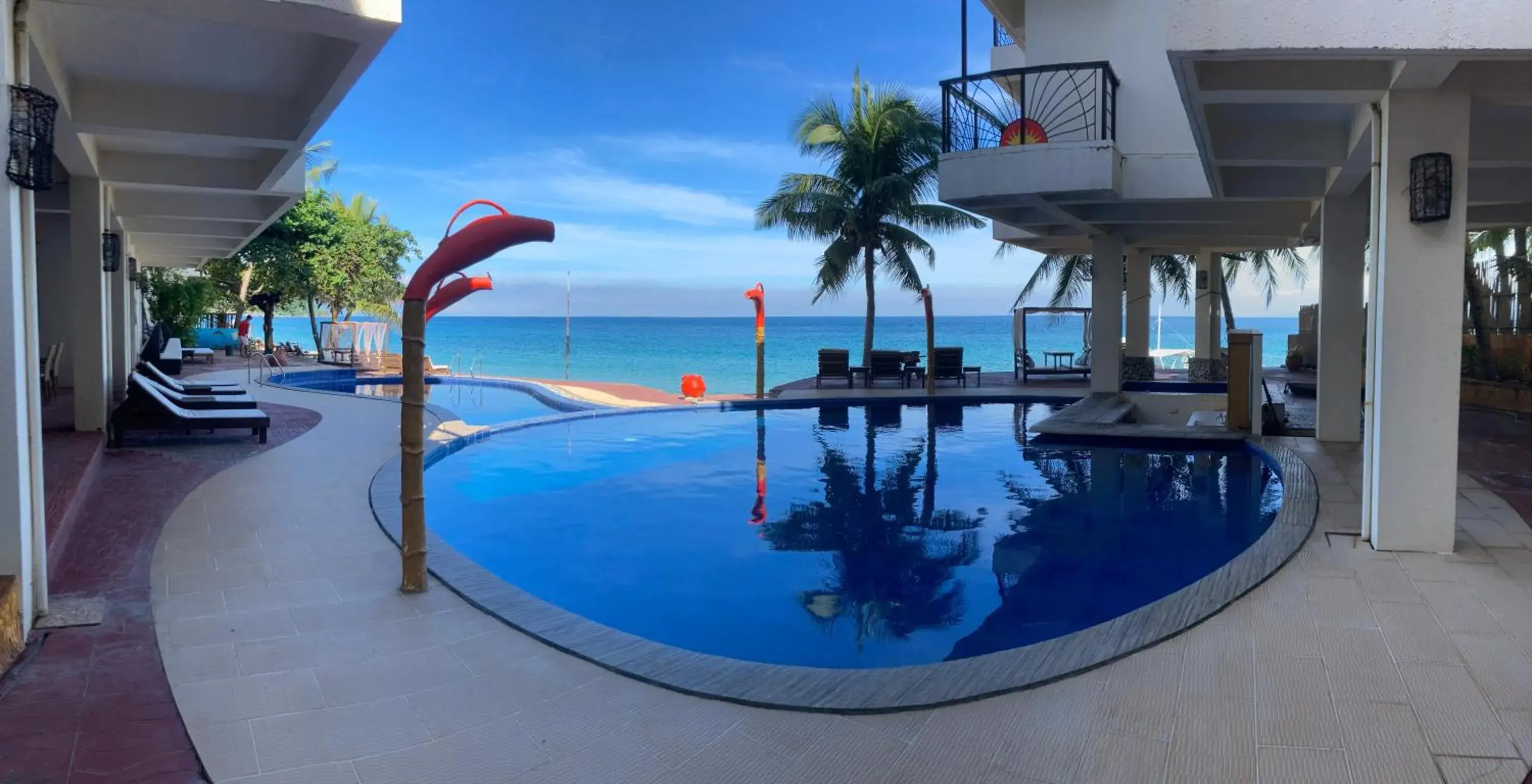 Swimming Pool in Sunset At Aninuan Beach Resort