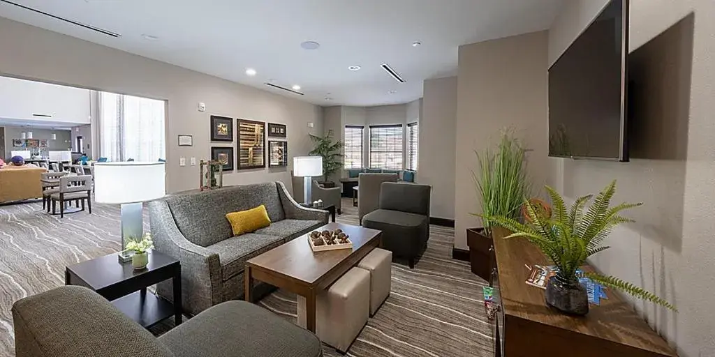 Communal lounge/ TV room, Seating Area in Staybridge Suites - Houston NW Cypress Crossings , an IHG Hotel