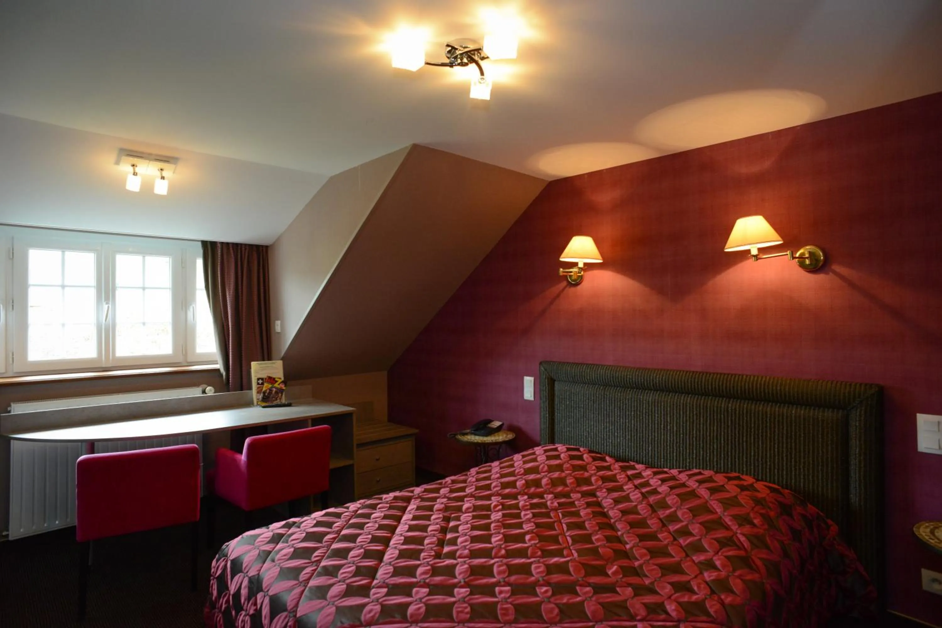 Photo of the whole room, Bed in Hôtel de La Croix d'Or