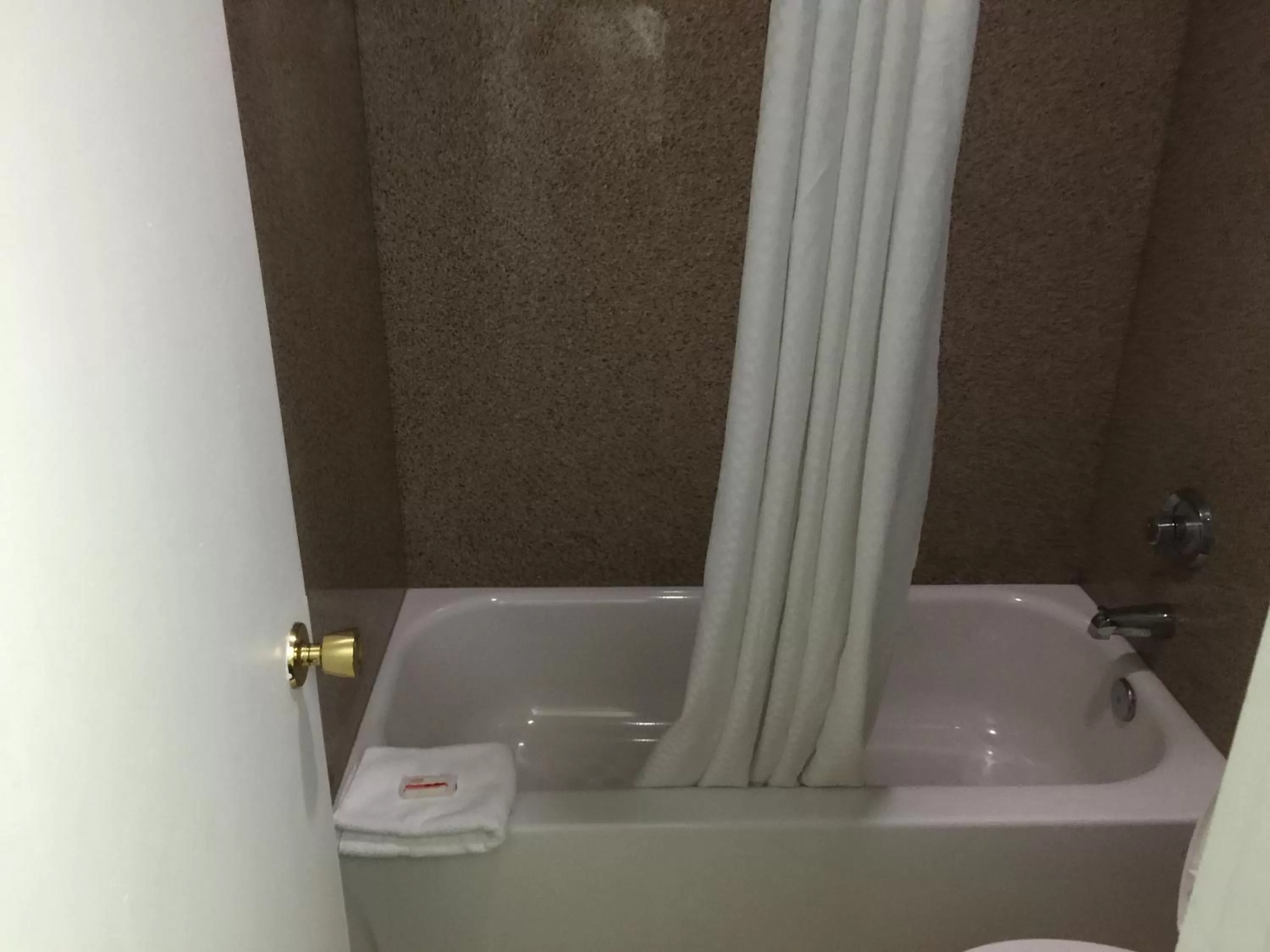 Bathroom in Days Inn by Wyndham Austin/University/Downtown