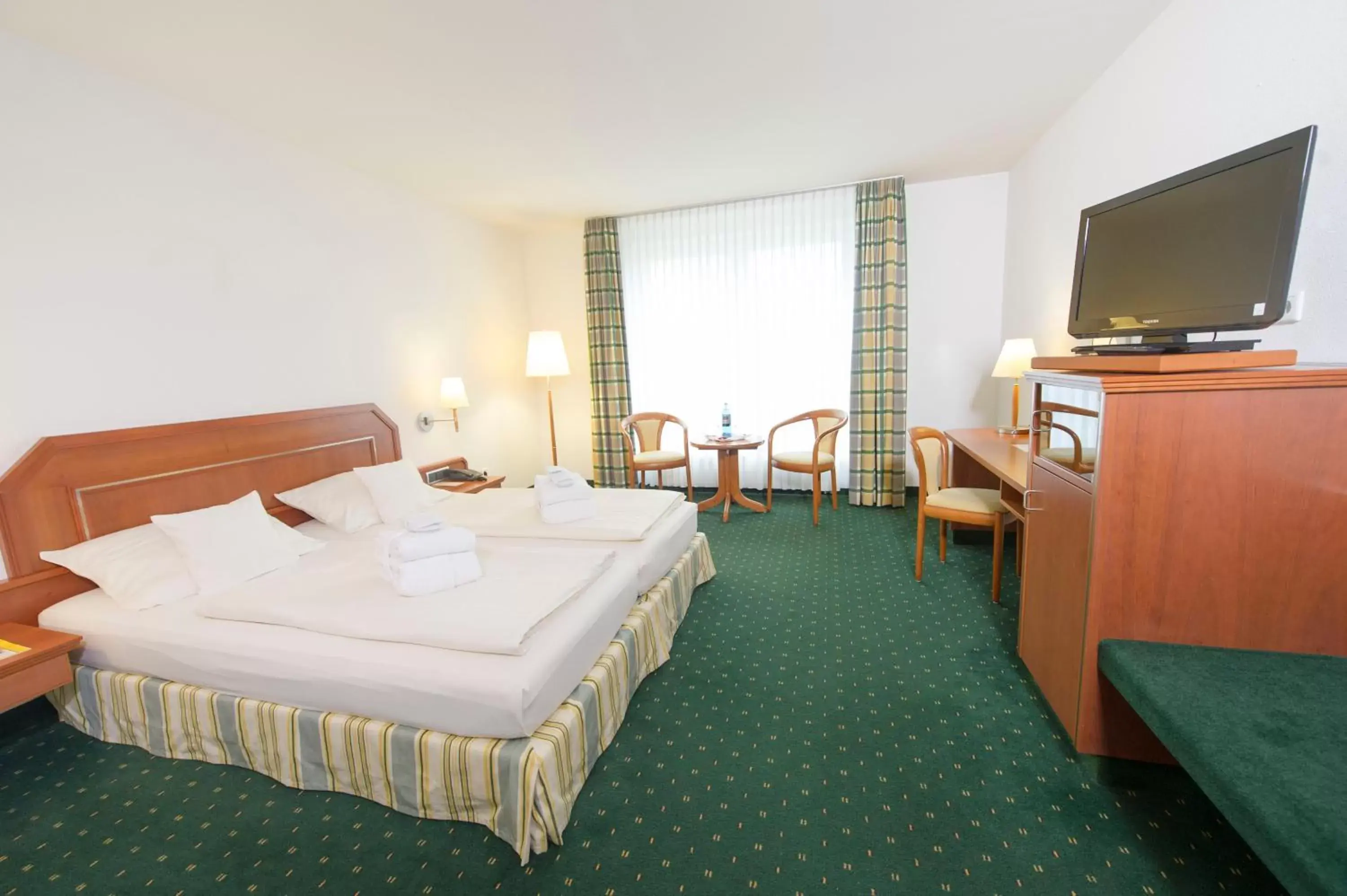 Photo of the whole room, Bed in Maifeld Sport- und Tagungshotel