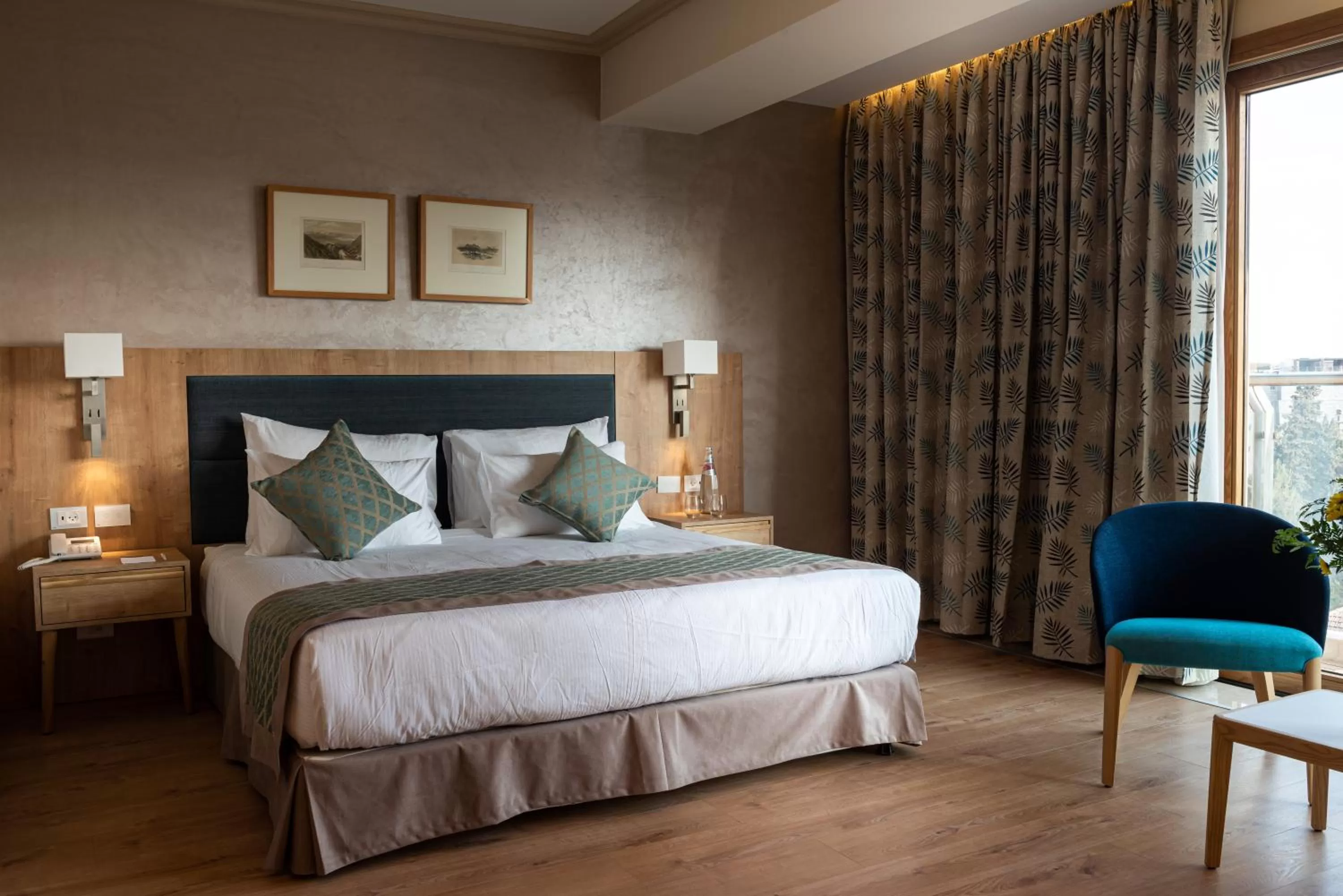 Bed in Ambassador Boutique Hotel