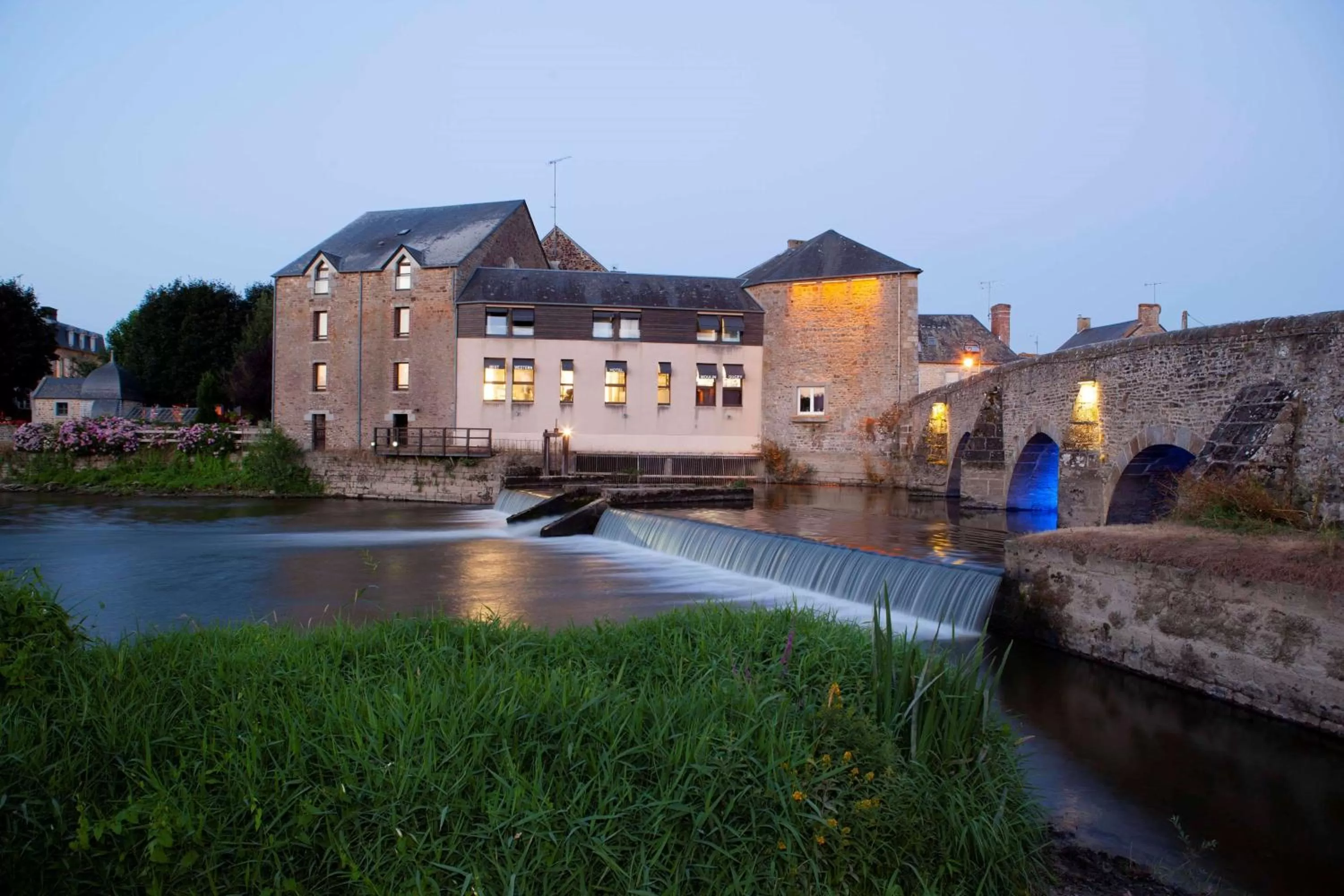 Property building in Best Western Le Moulin de Ducey