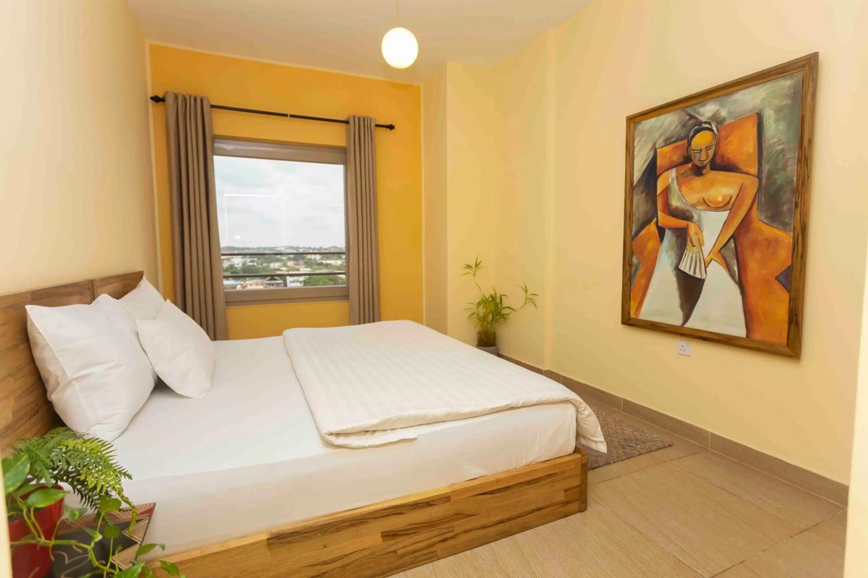 Bed in Roots Hotel Apartment