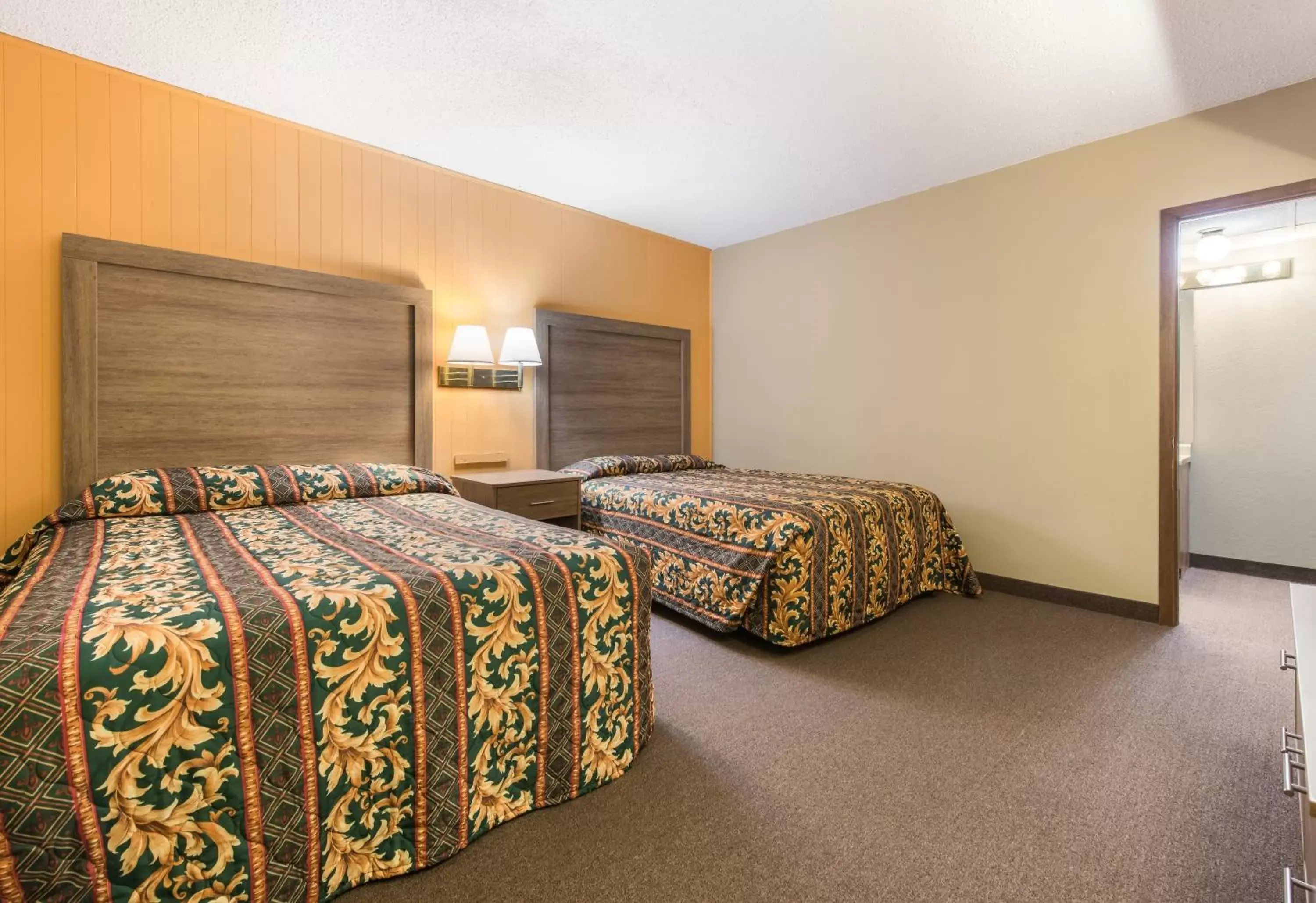 Bed in LeConte Motor Lodge A Ramada by Wyndham