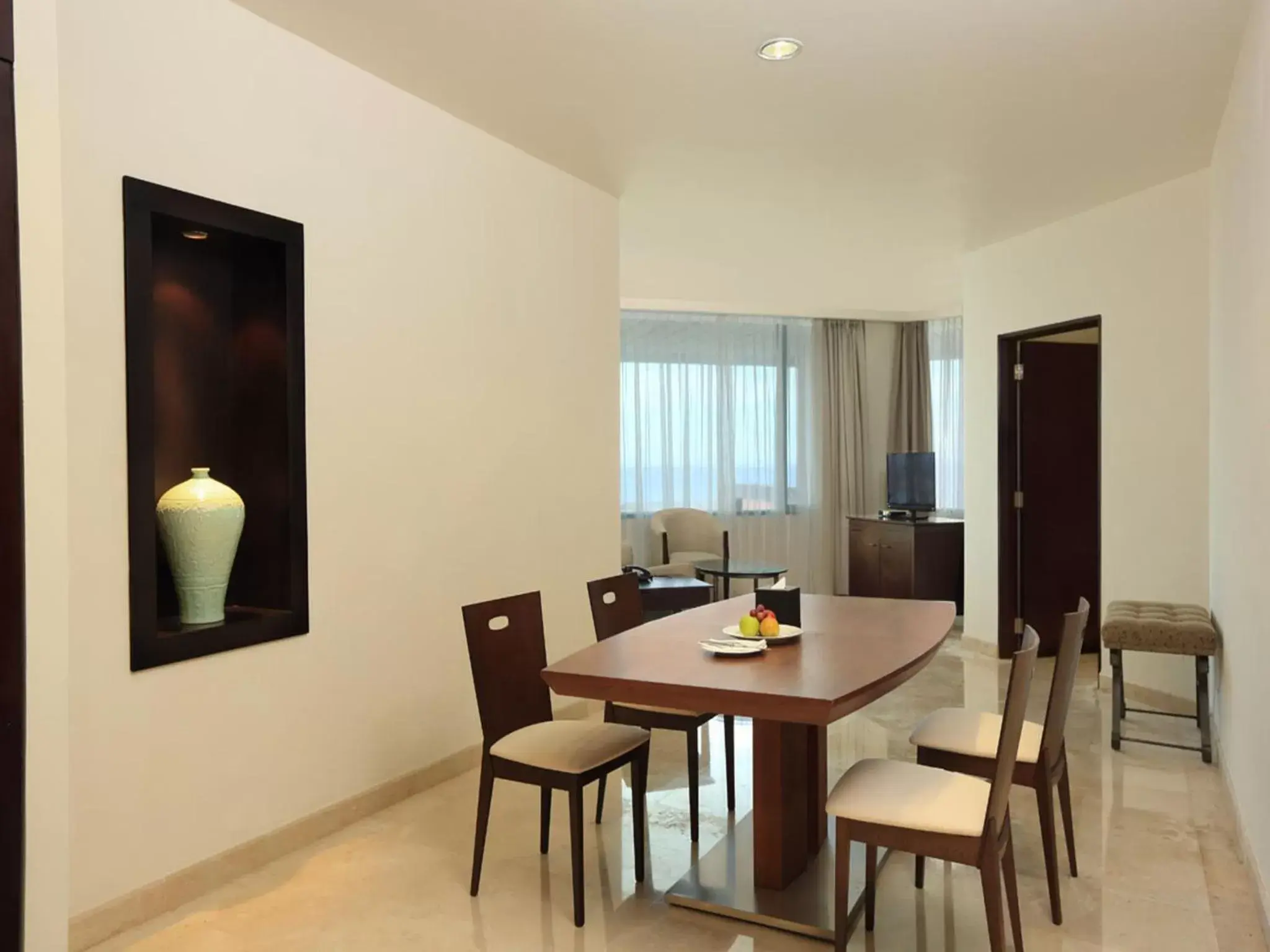 Living room, Dining Area in Aryaduta Manado