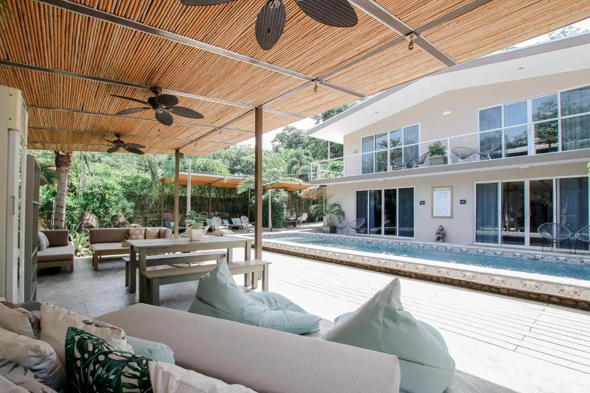 Communal lounge/ TV room, Swimming Pool in Tamarindo Bay Boutique Hotel - Adults Only