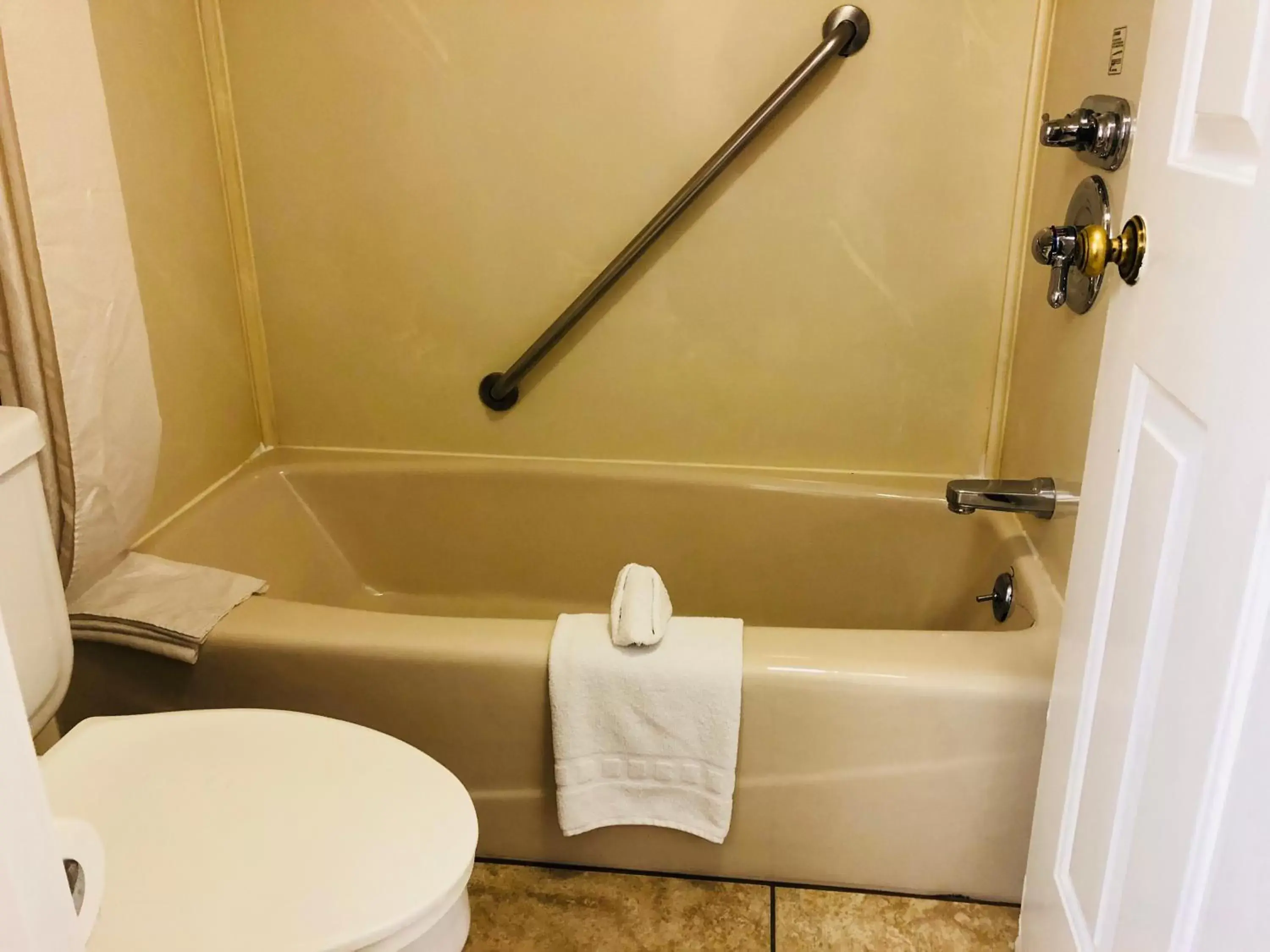 Bathroom in Dynasty Suites Hotel