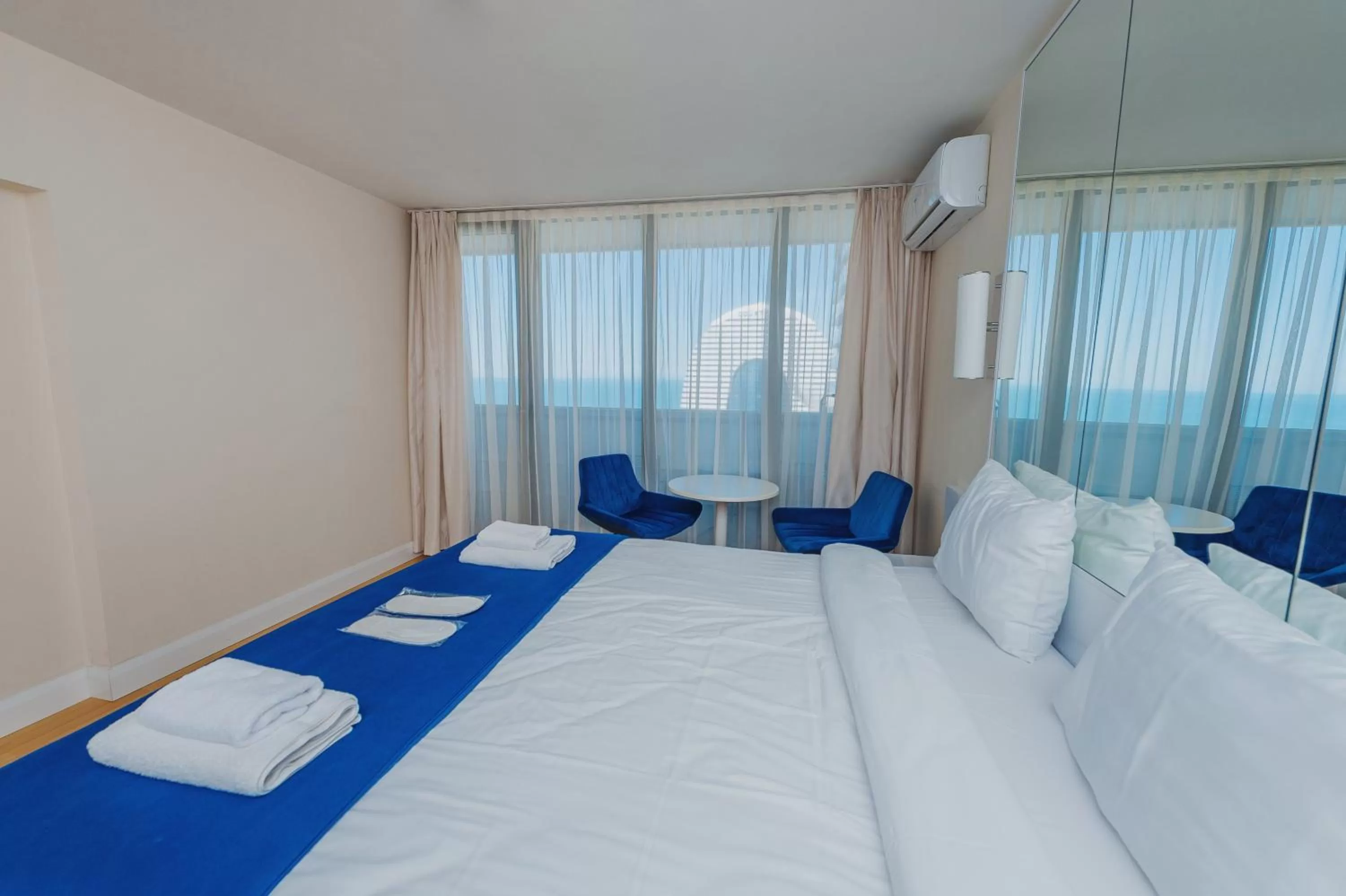 Bed in Orbi City Luxury Suite