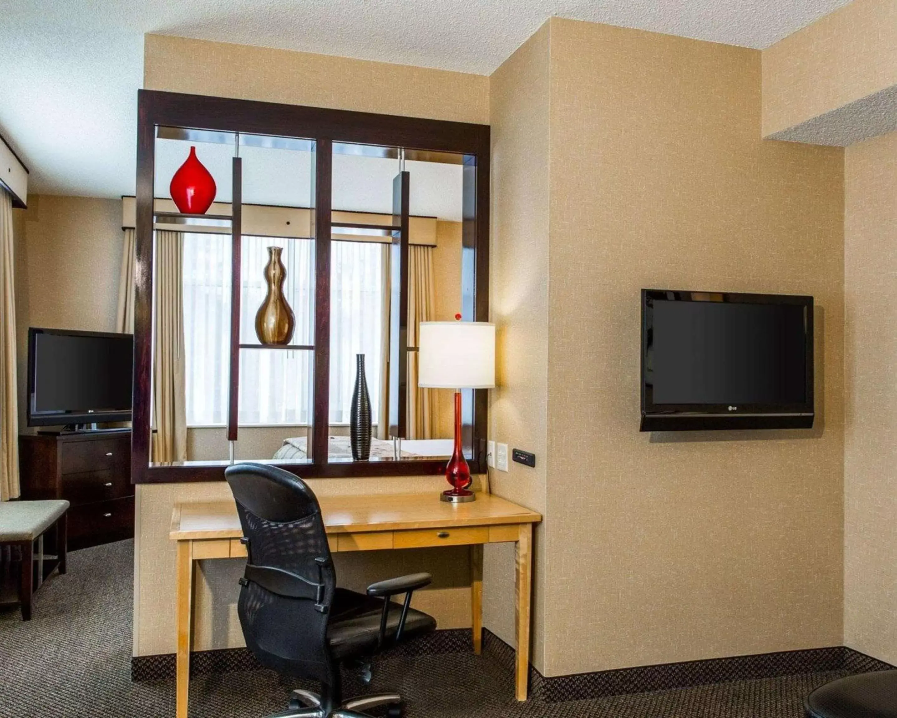 Photo of the whole room, TV/Entertainment Center in Cambria Hotel Traverse City