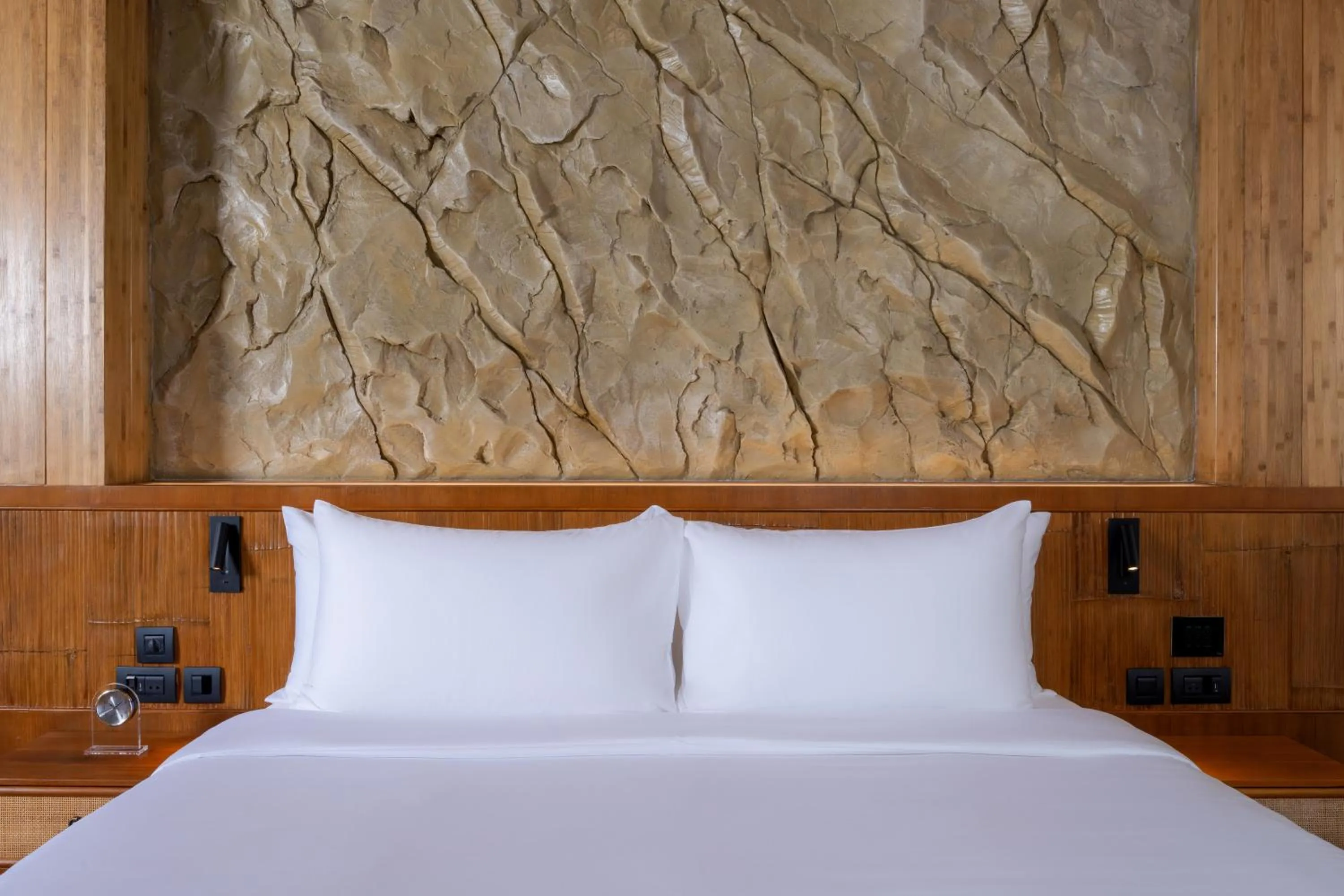 Bed in SINAE Phuket Luxury Hotel