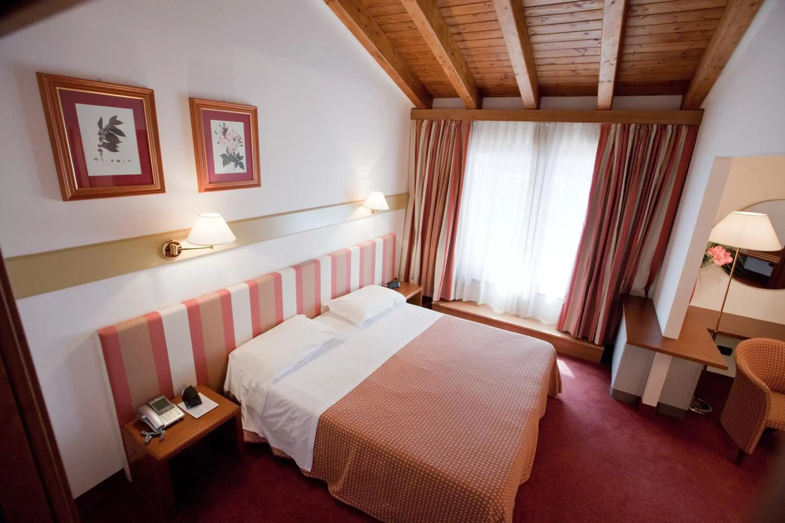 Bed in Eurohotel Palace Maniago