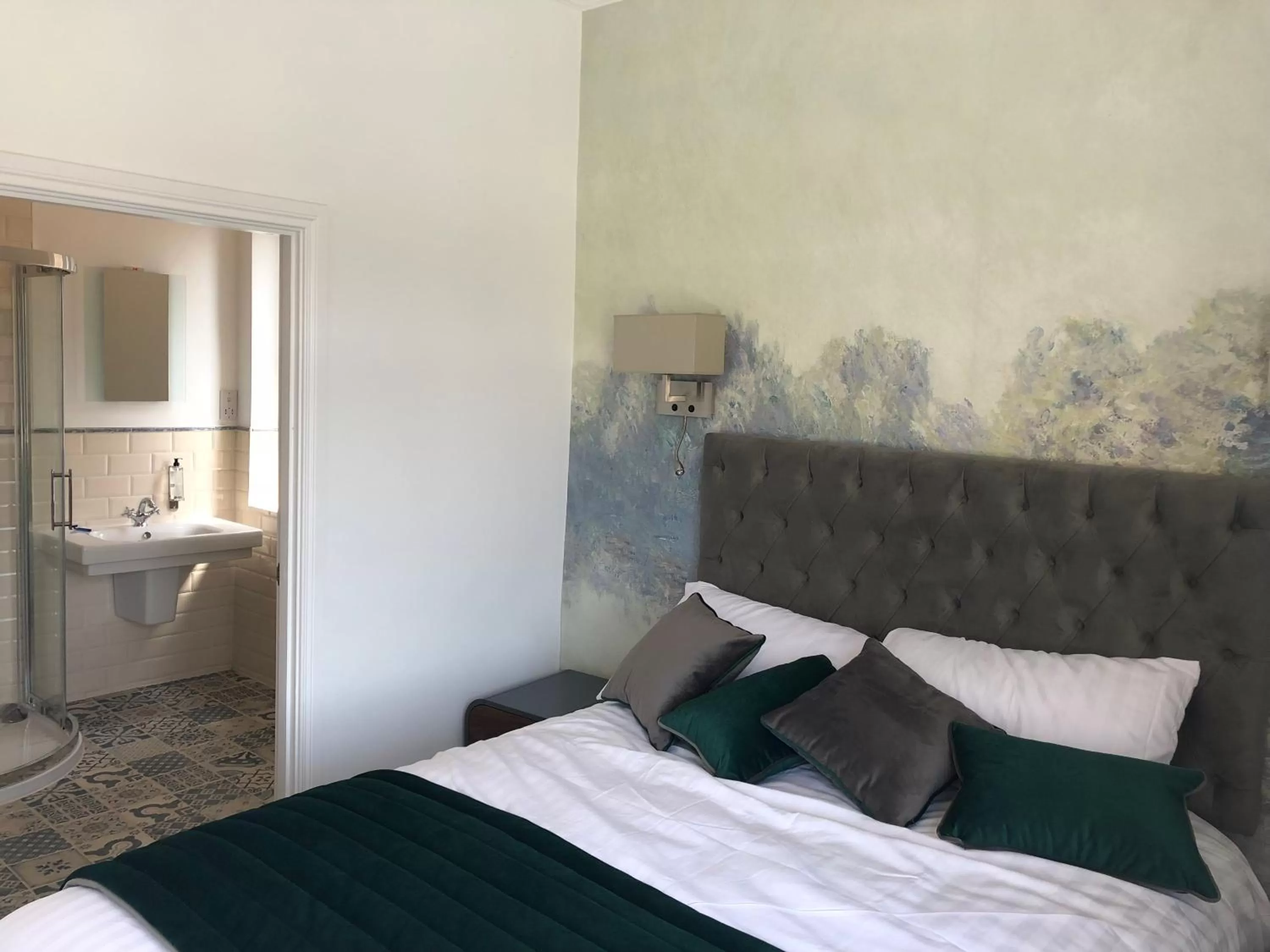 Photo of the whole room, Bed in The Strand Hotel, the former residence of Oscar Wilde