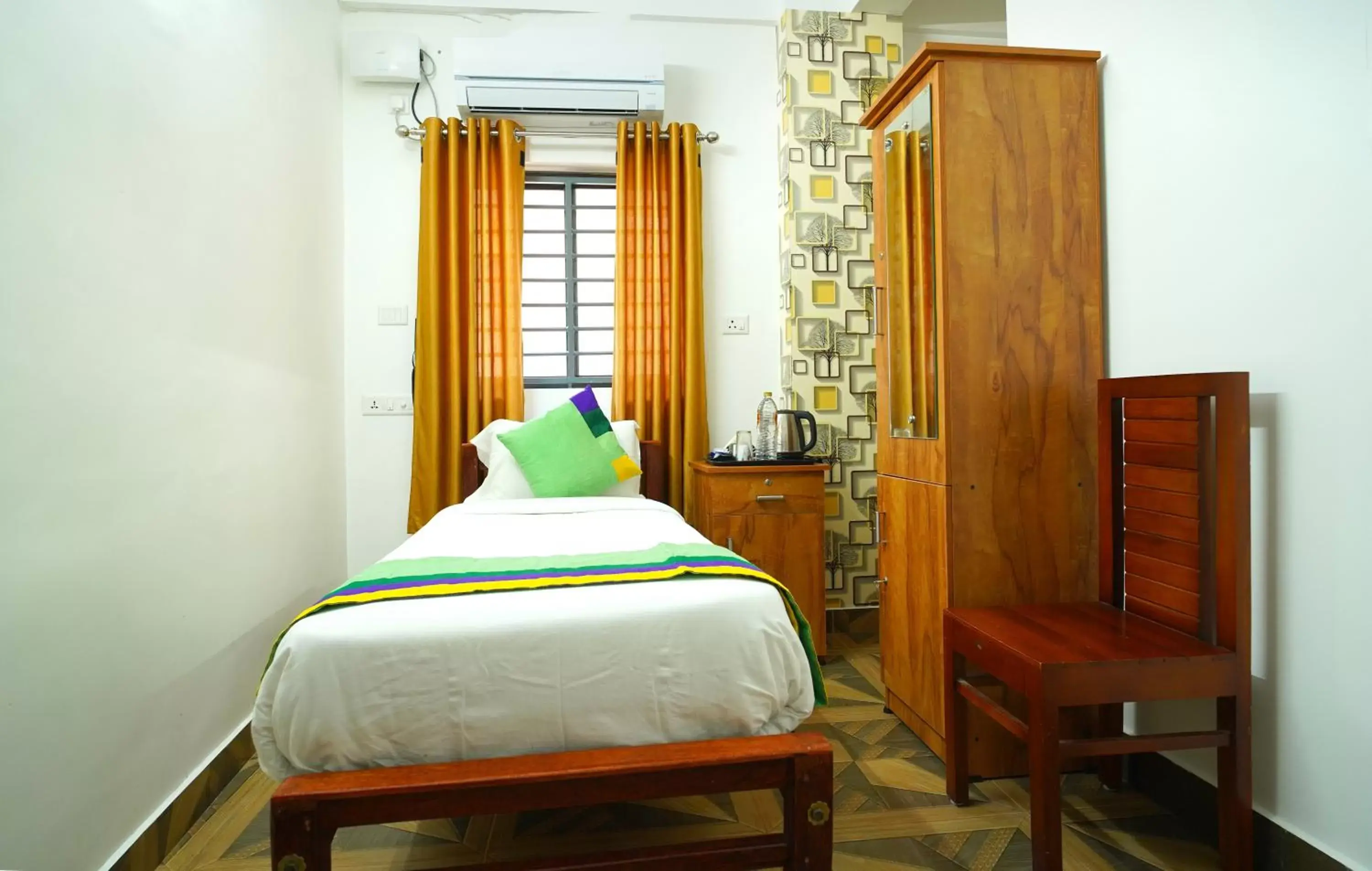 Bed in Treebo Trend Nirupama Apartment