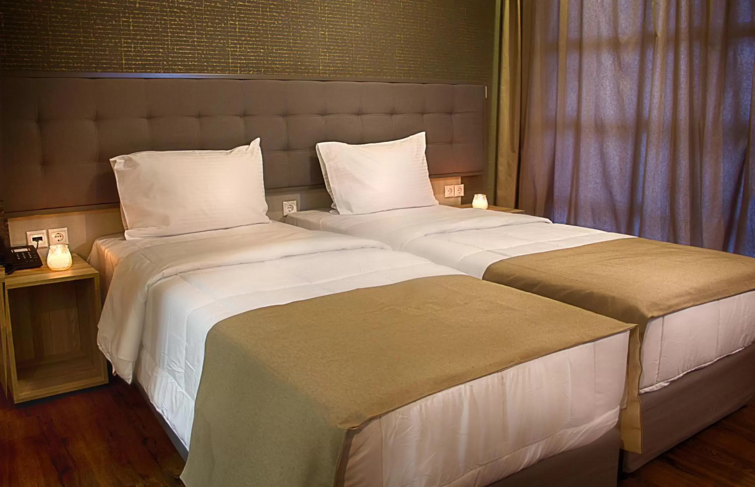 Bed in Athlos Hotel