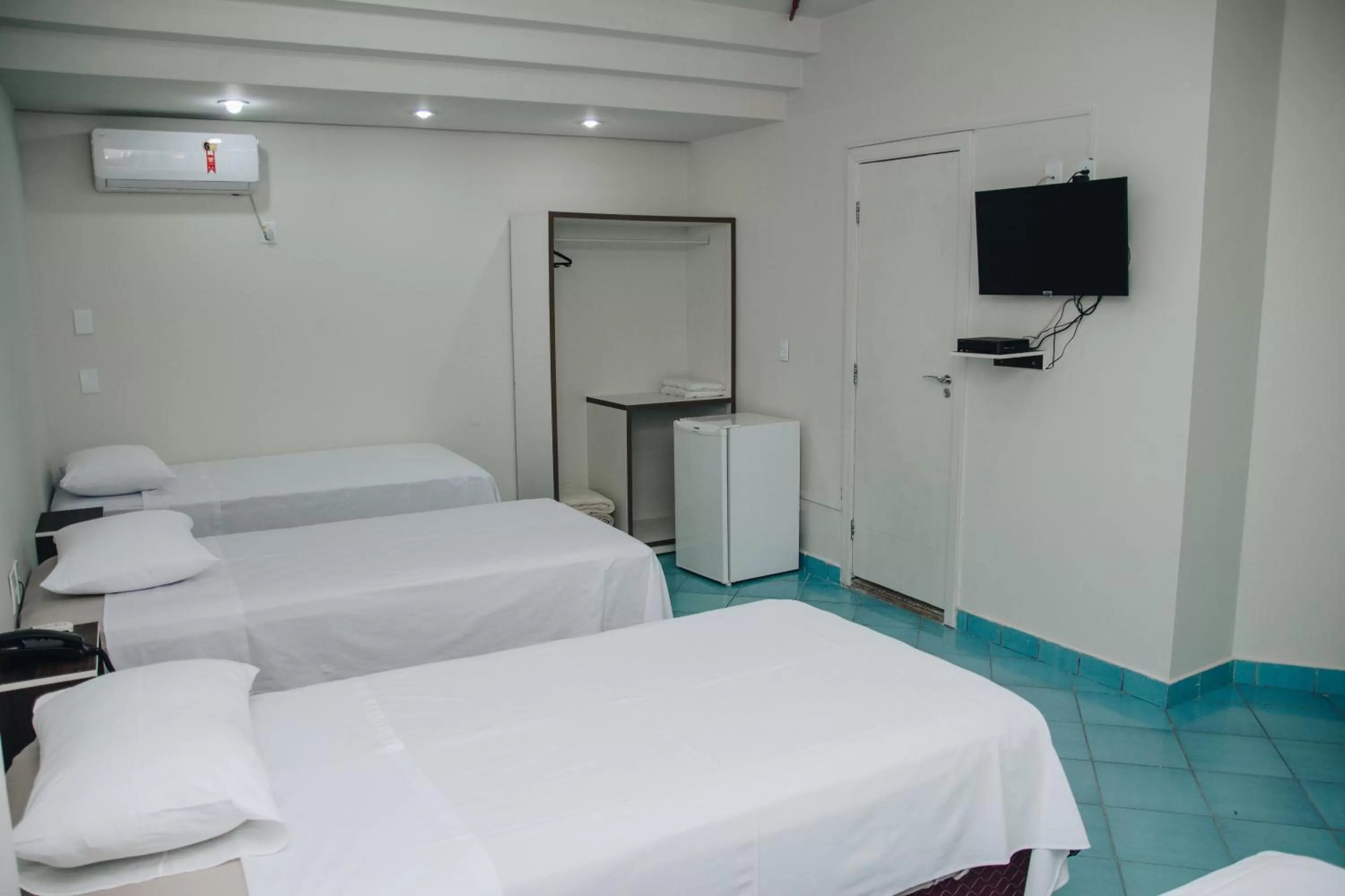 Bed in SAMIR HOTEL COMFORT