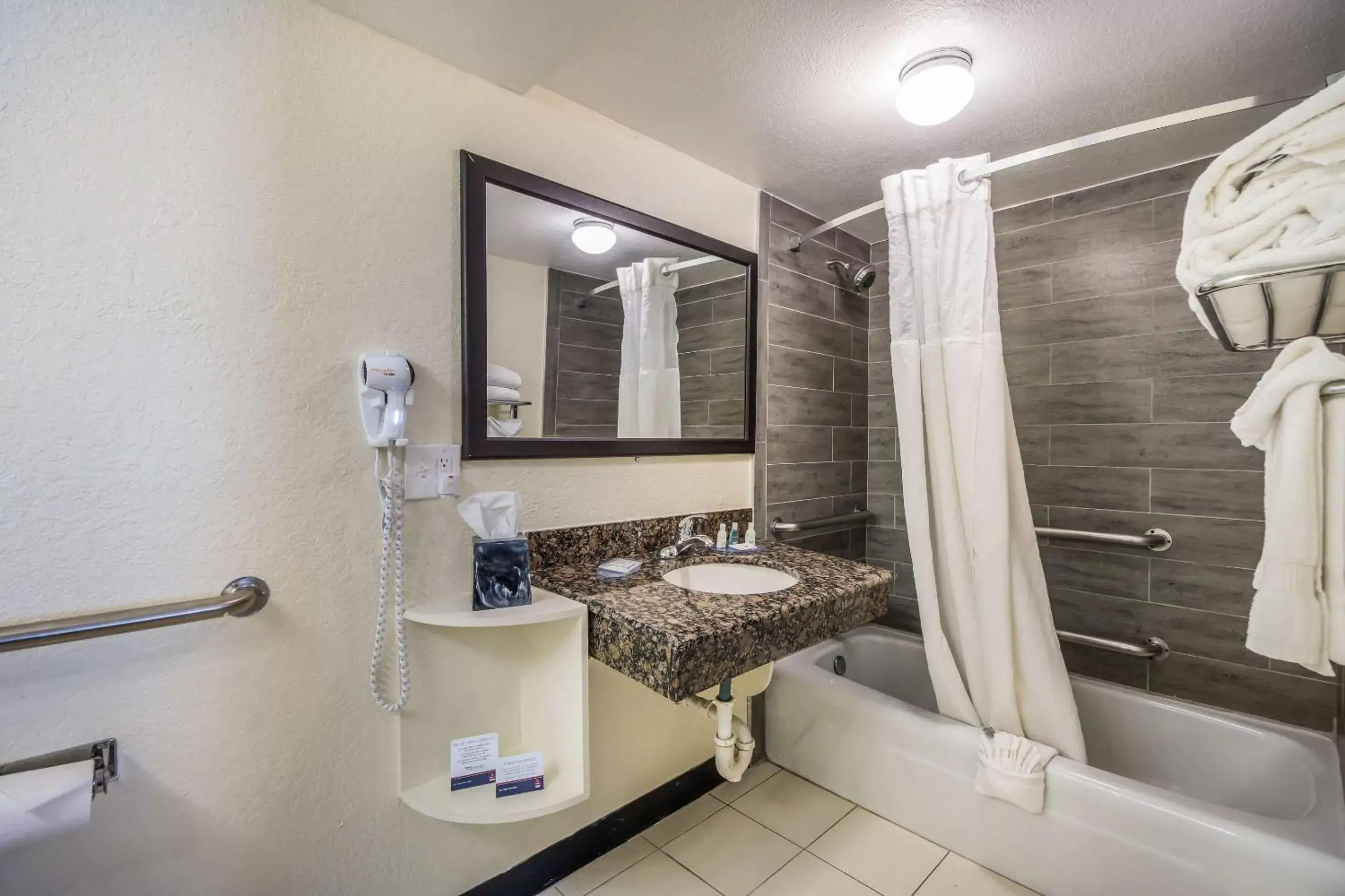 Bathroom in Clarion Inn & Suites Central Clearwater Beach