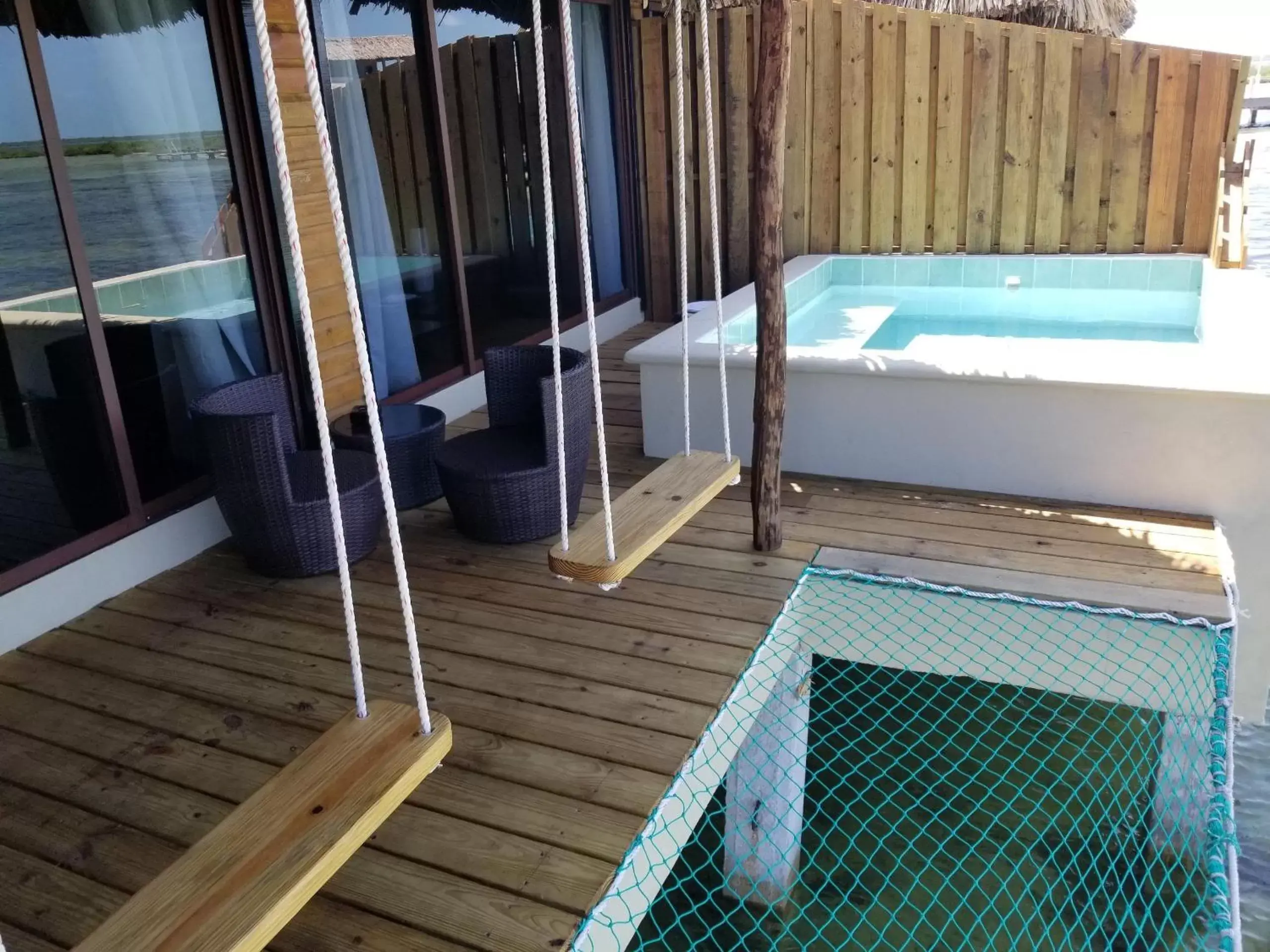 Balcony/Terrace, Bathroom in Lina Point Belize Overwater Resort