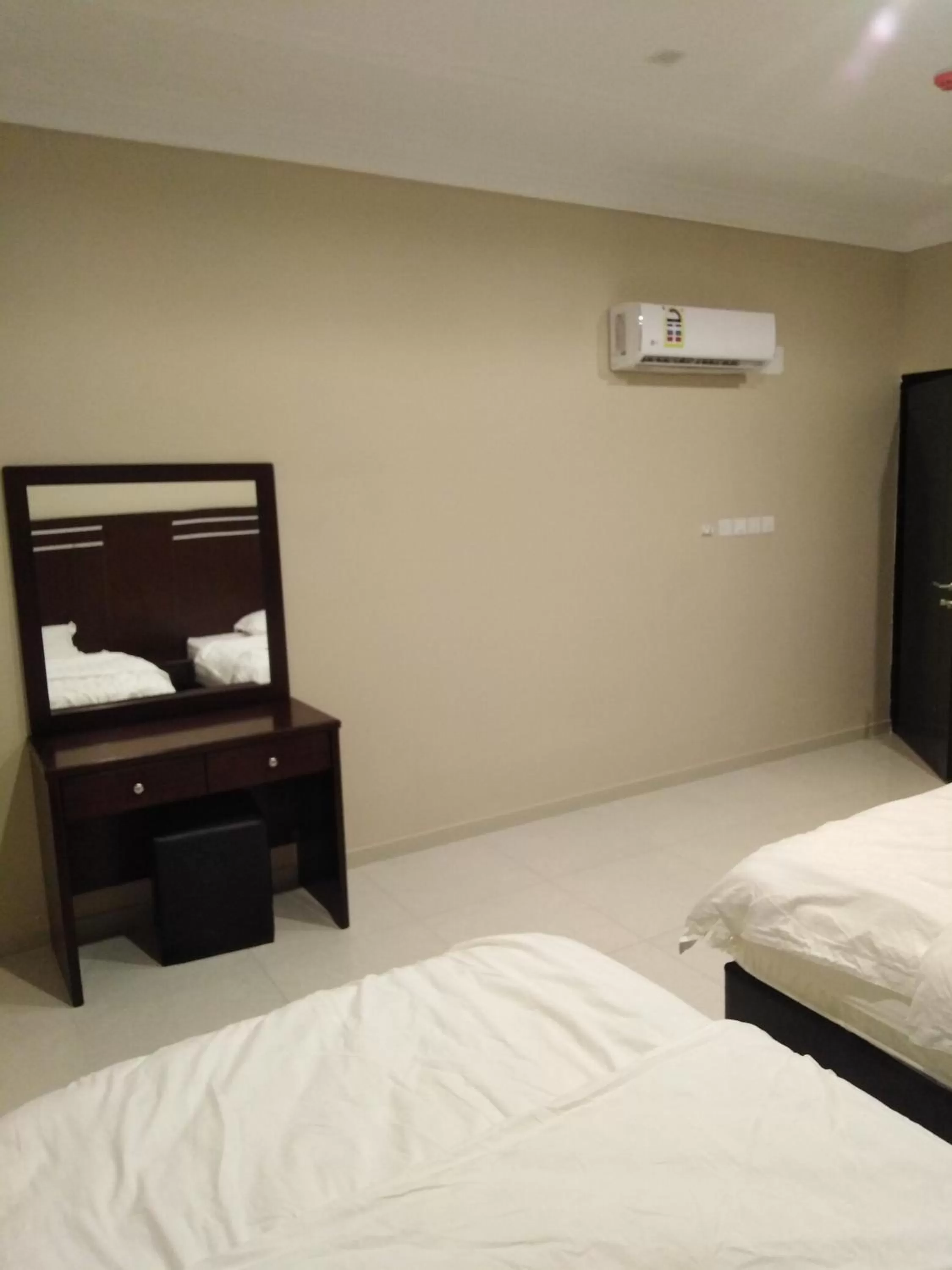 Bed in Sunrise Furnished Apartment