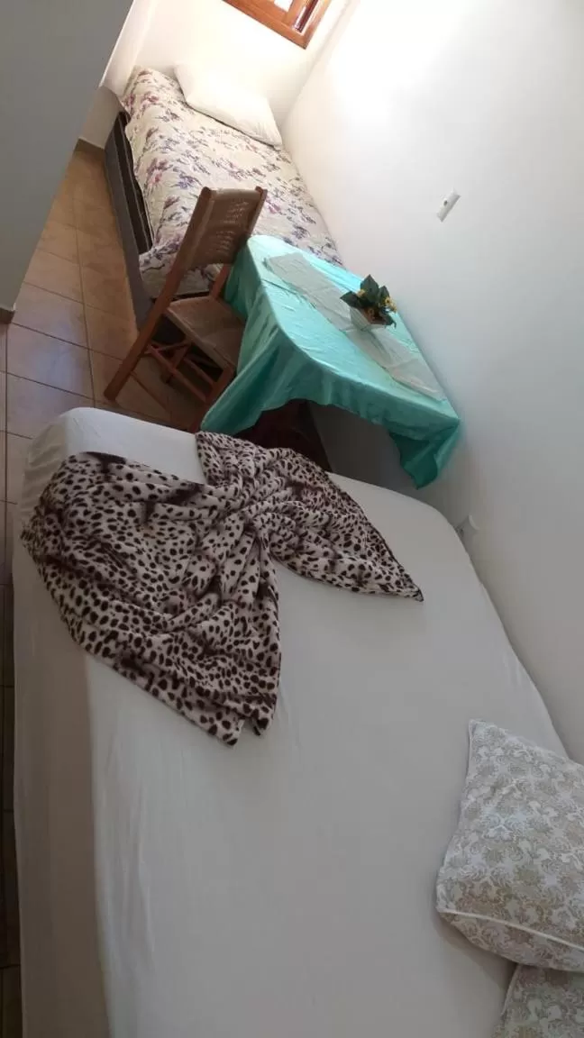 Bed in Hotel Pousada Rolantchê