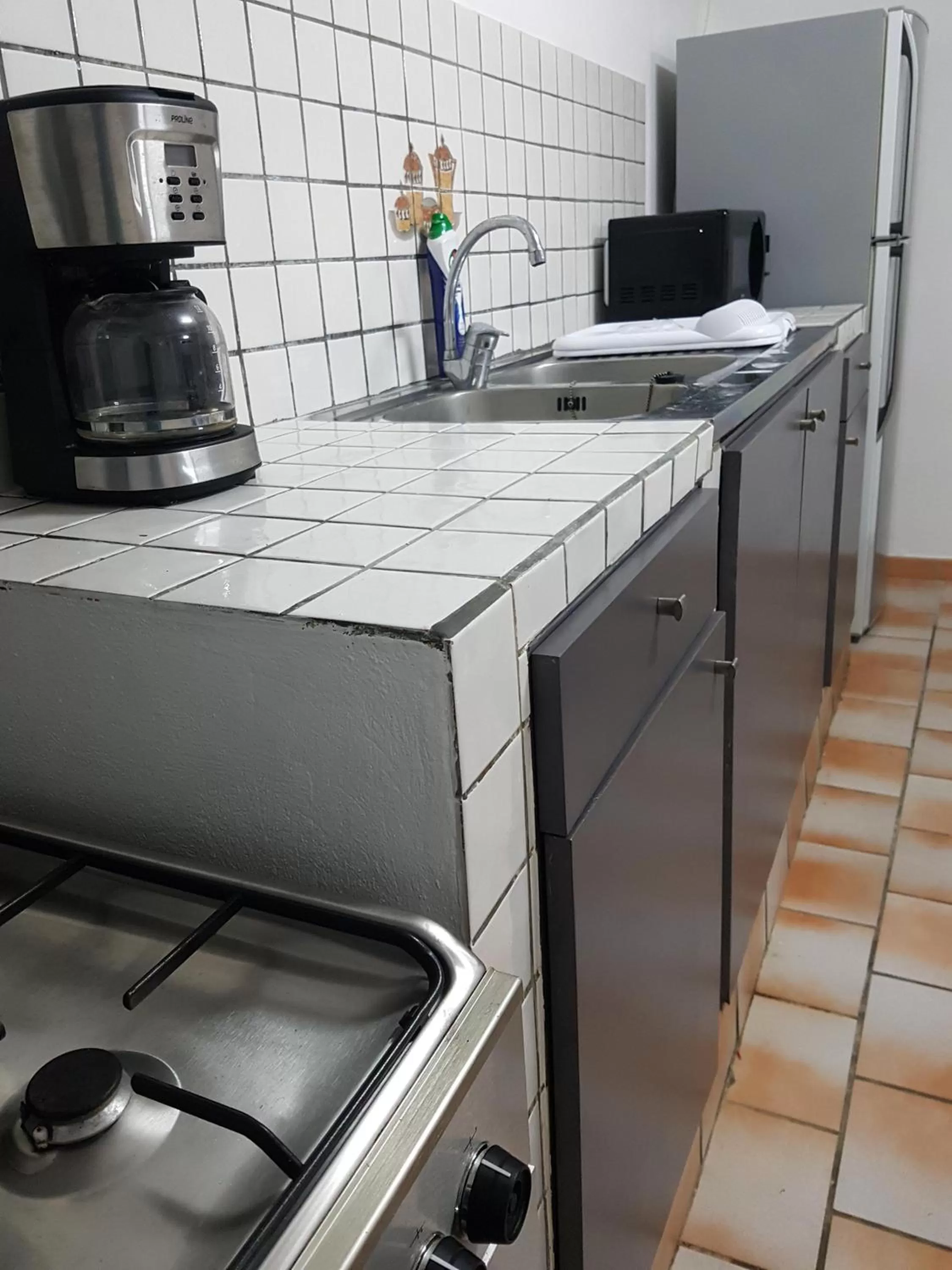 Kitchen or kitchenette in Appartement de la Baie