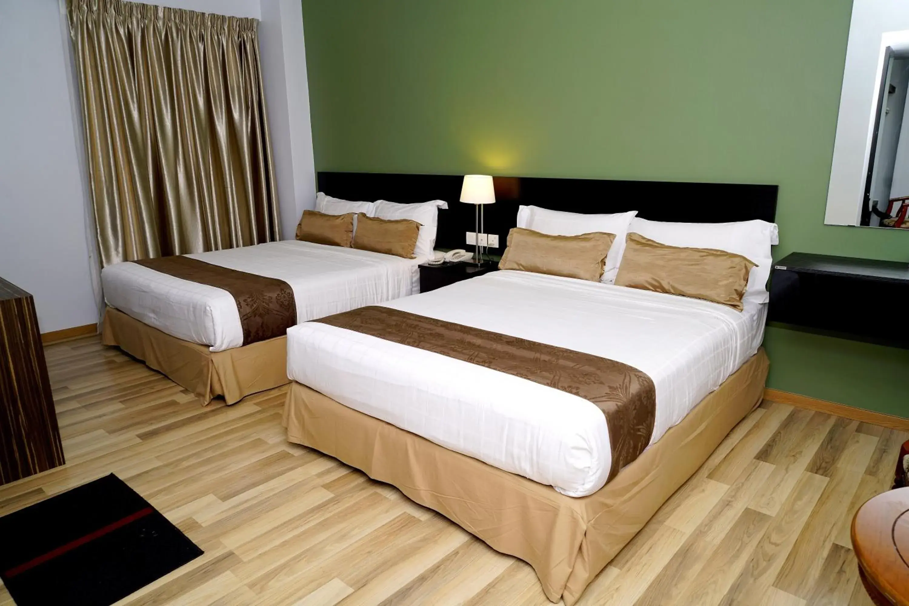 Bed in Alami Garden Hotel