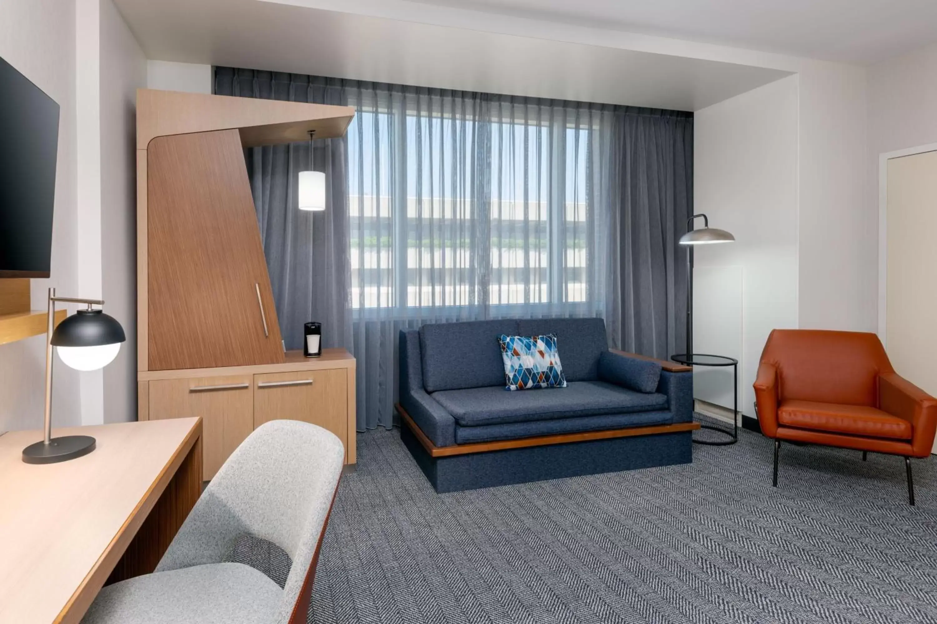 Photo of the whole room, Seating Area in Courtyard by Marriott Buffalo Downtown/Canalside