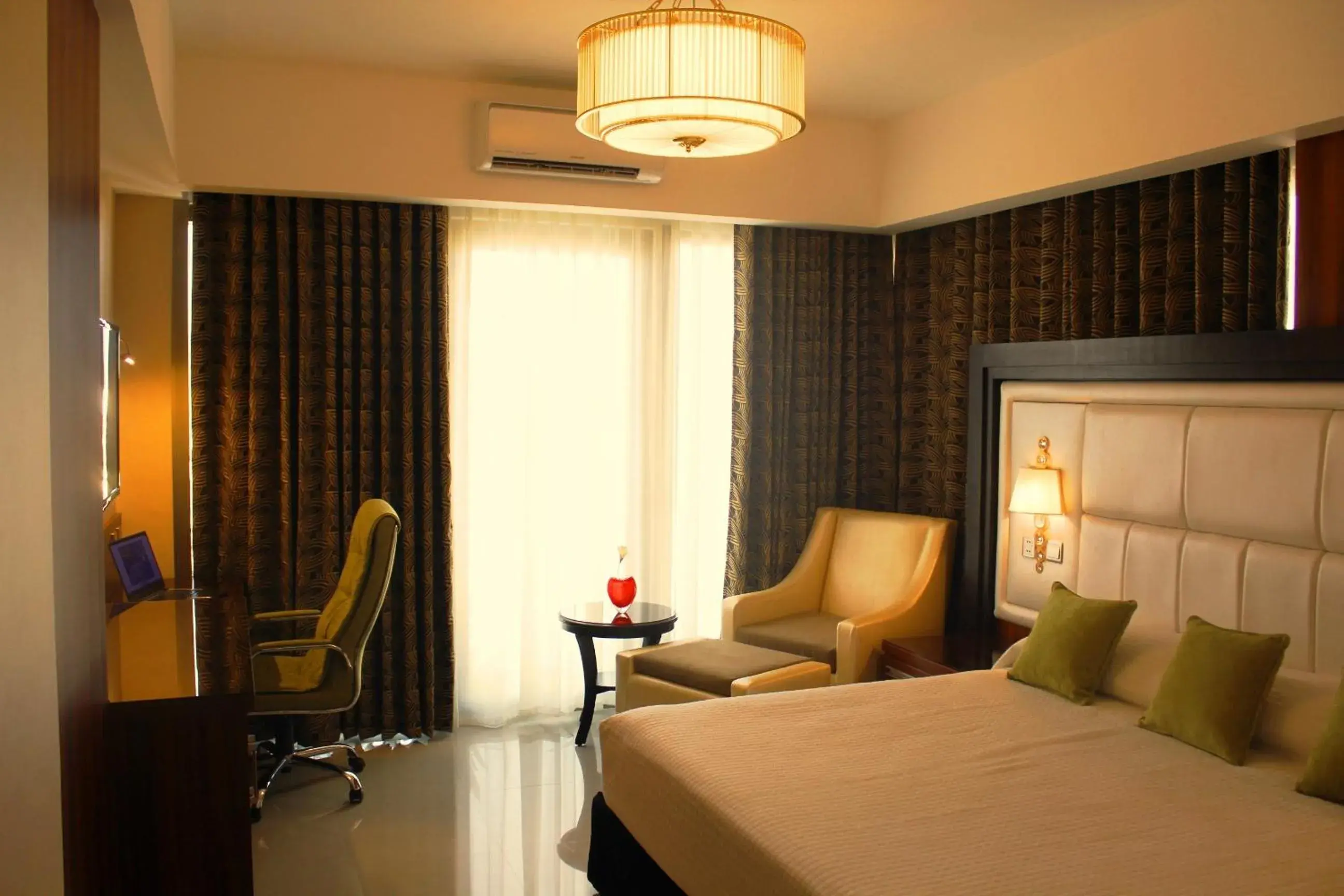 Seating area, Bed in Central Park Tower Resort Seating area, Bed in Central Park Tower Resort