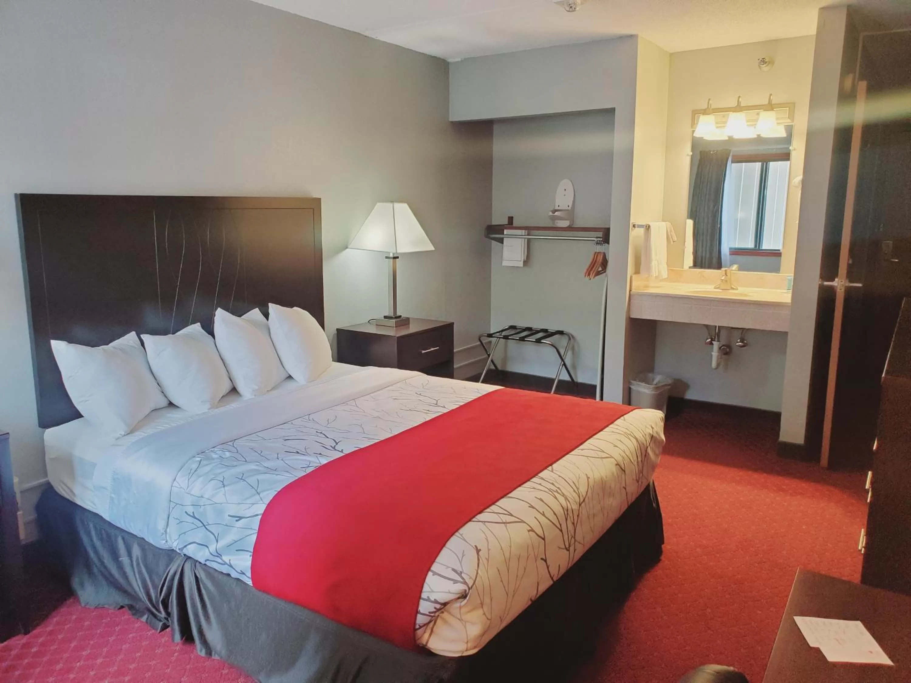 Bed in Blackstone Lodge and Suites