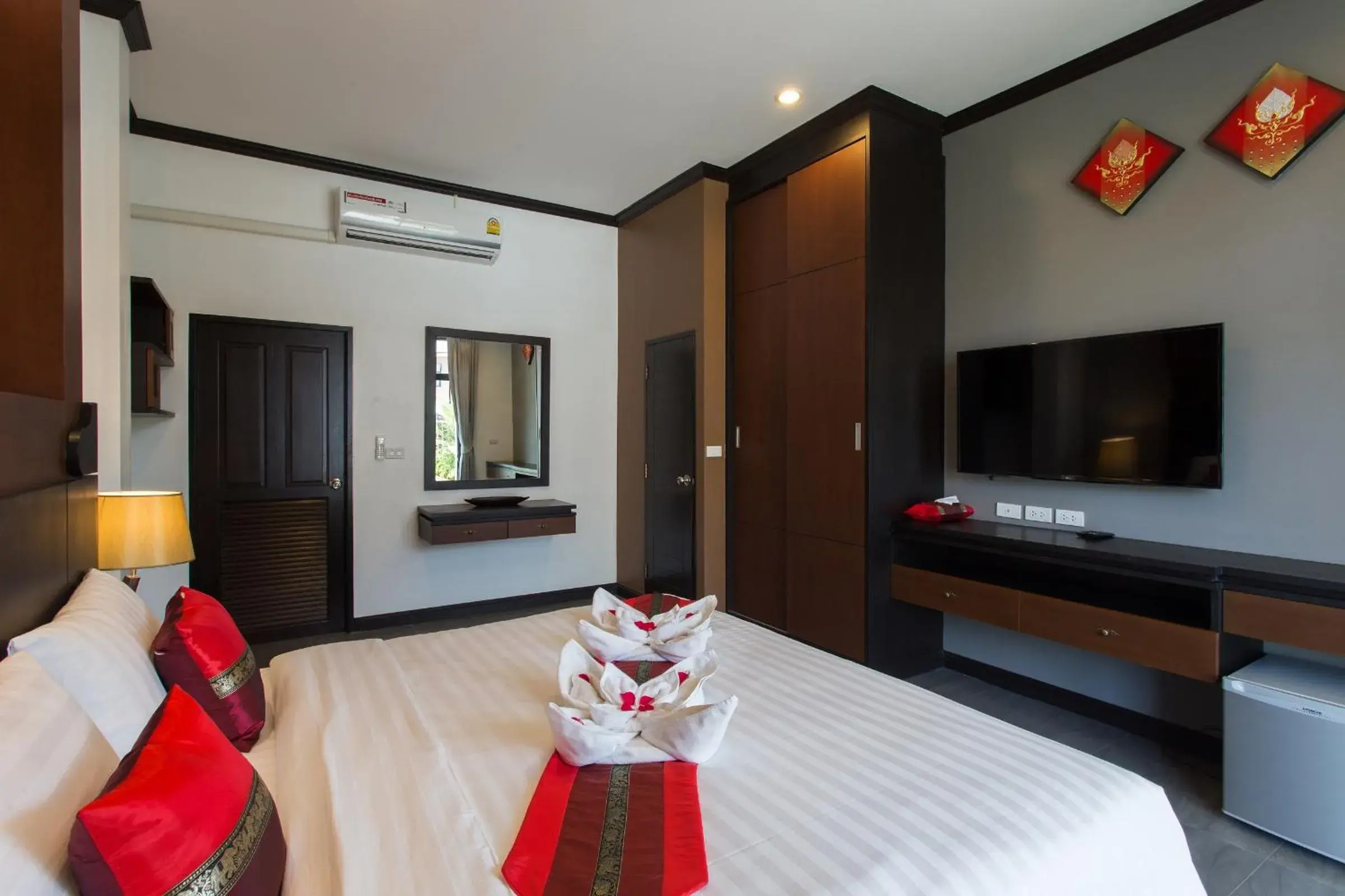 Bed, TV/Entertainment Center in The Best Aonang Villas