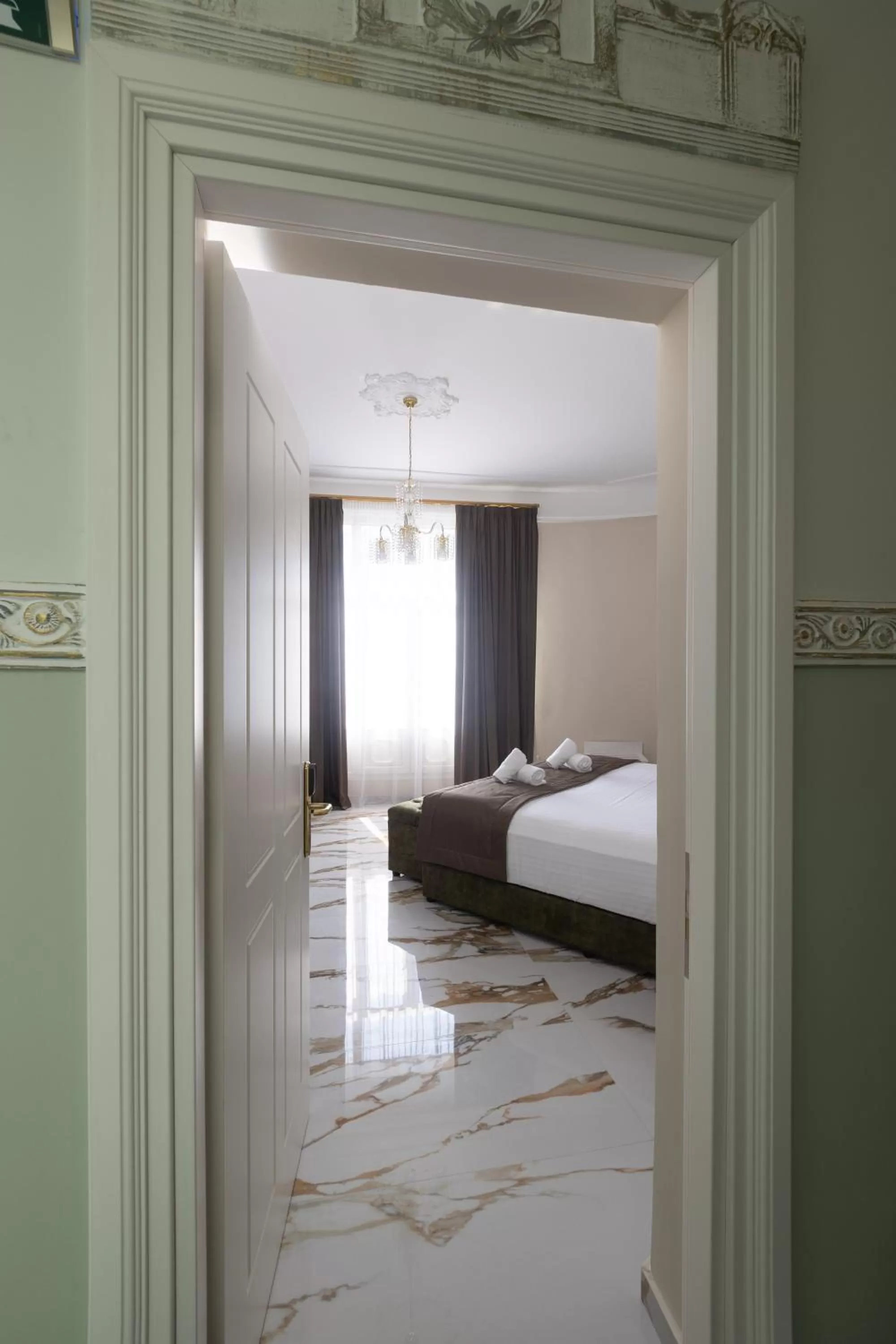 Bed in Modern Revival Luxury Hotel