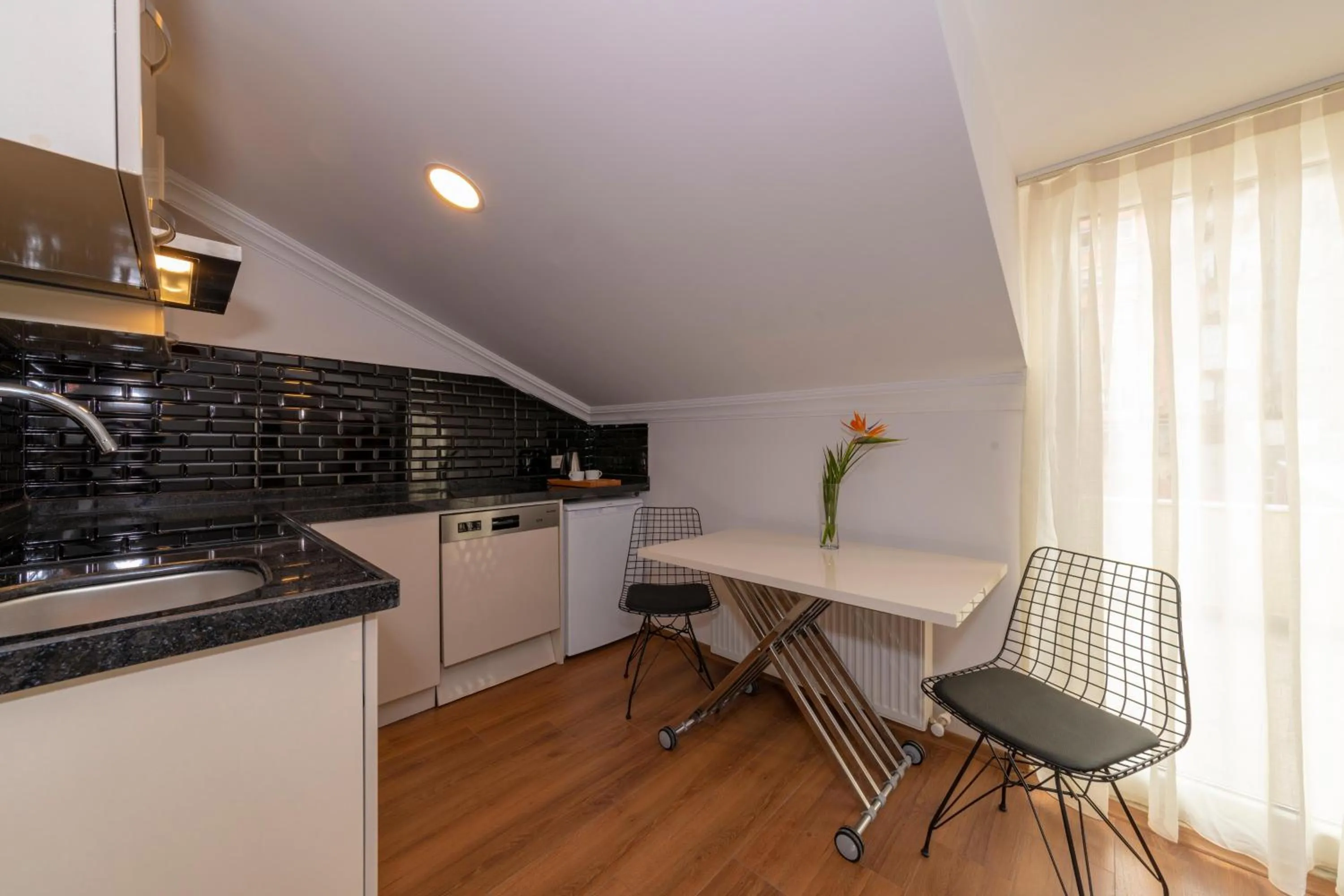 Kitchen or kitchenette in Joy Suites