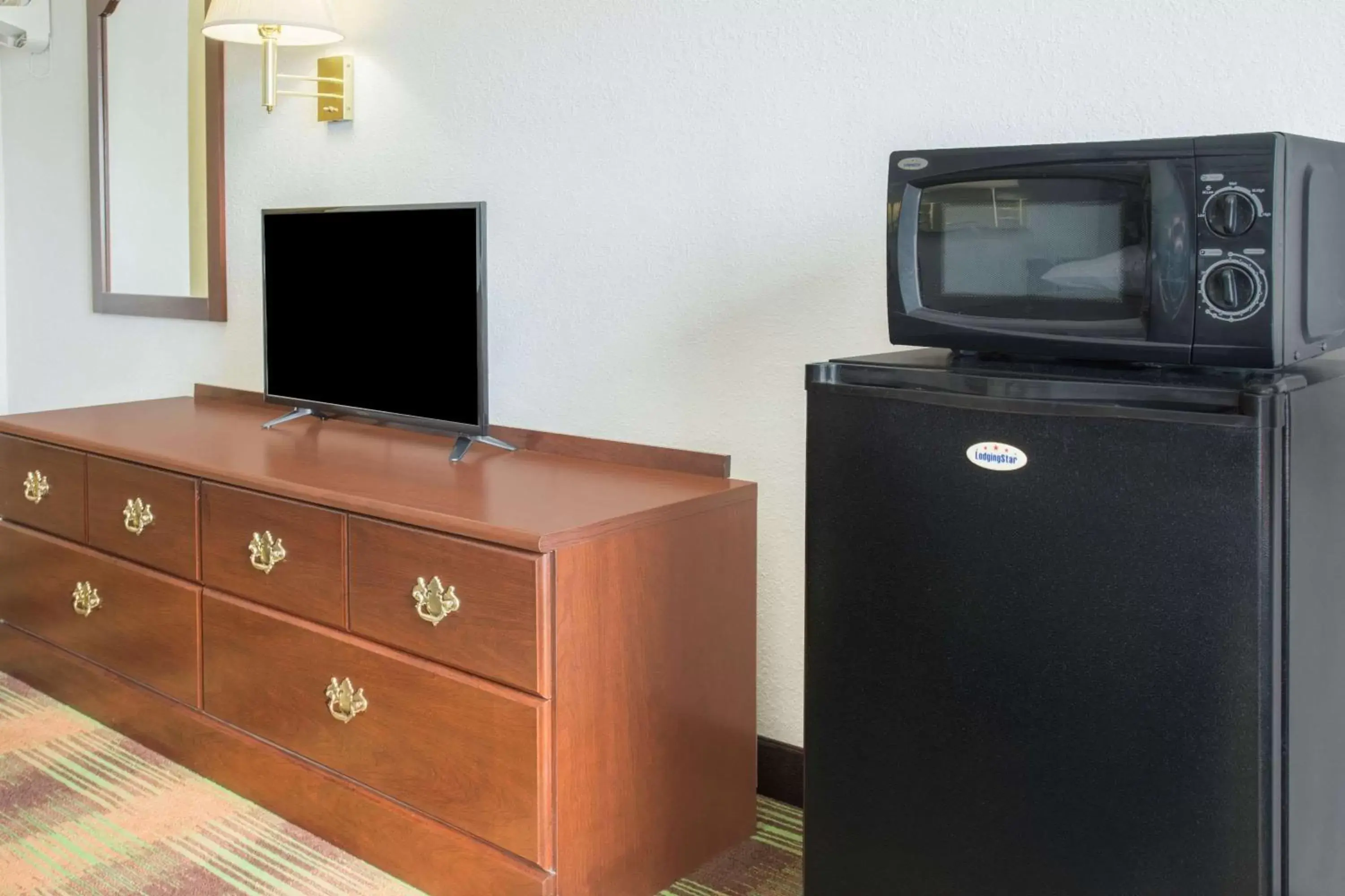 Photo of the whole room, TV/Entertainment Center in Super 8 by Wyndham Sweet Springs