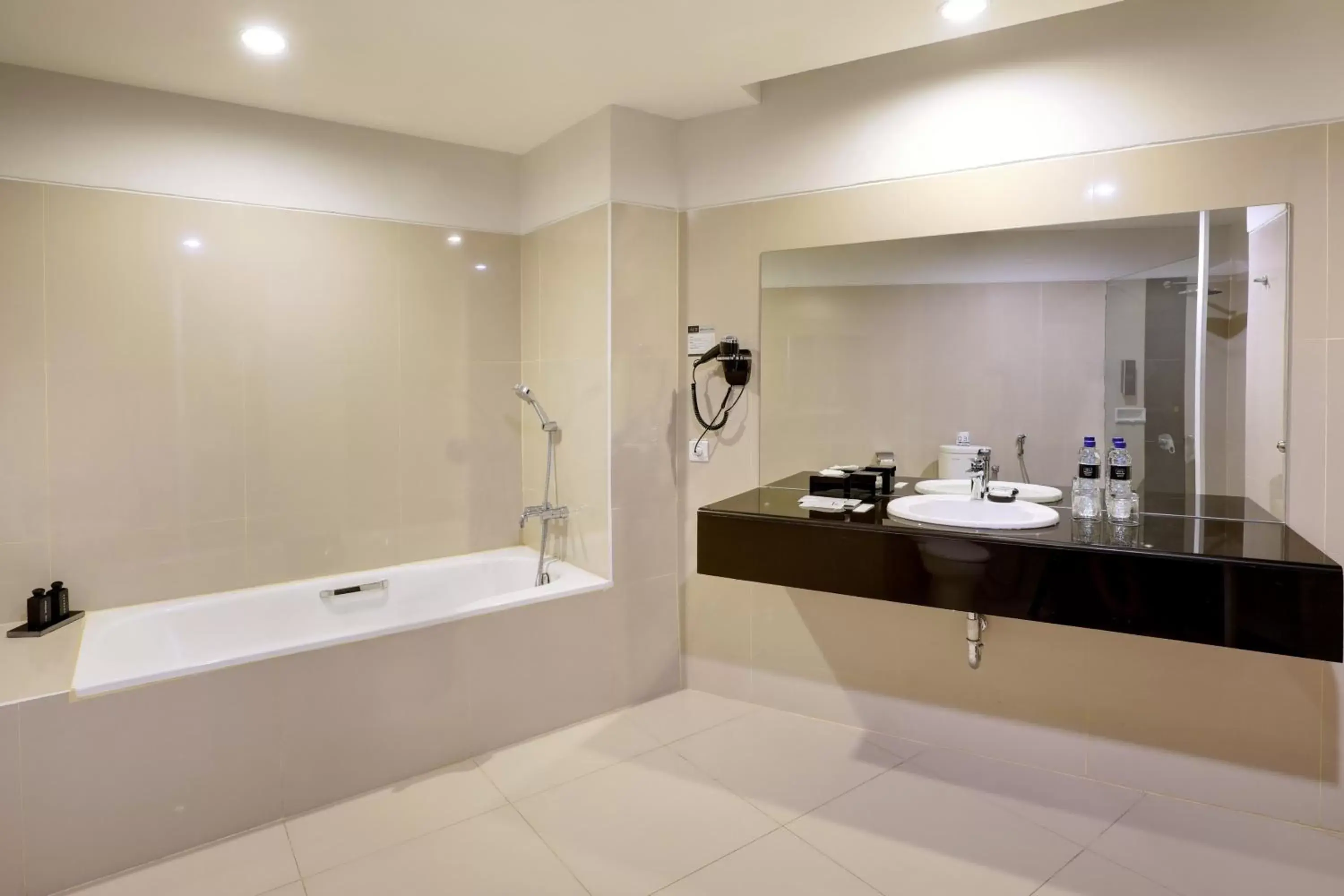 Bath, Bathroom in Hotel Neo Palma Palangkaraya by ASTON