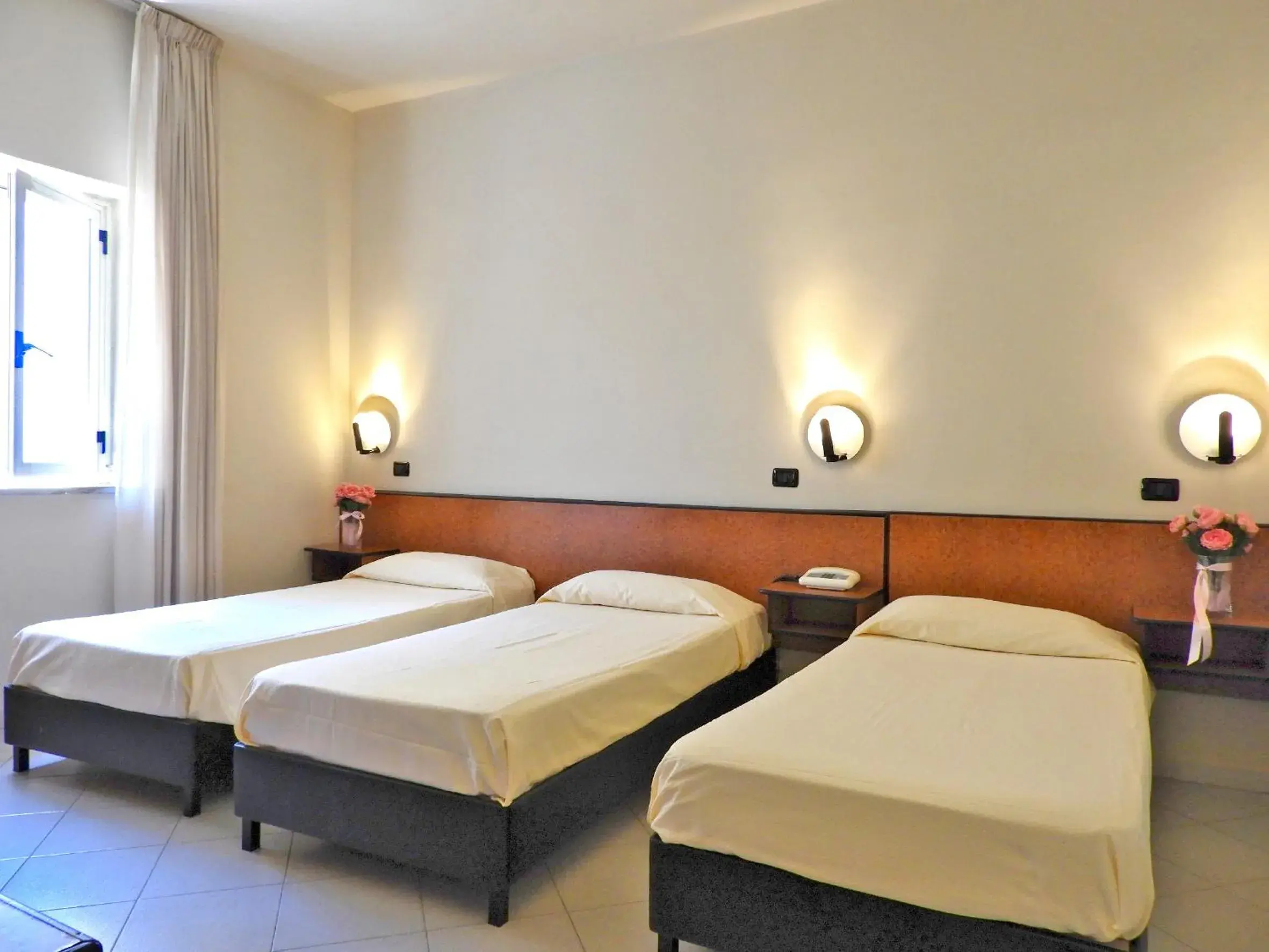 Bed in Hotel Scigliano