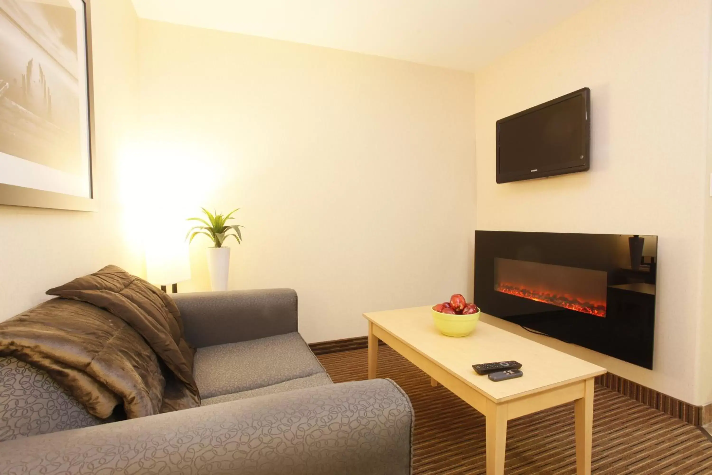 Living room, TV/Entertainment Center in Vegreville Suites