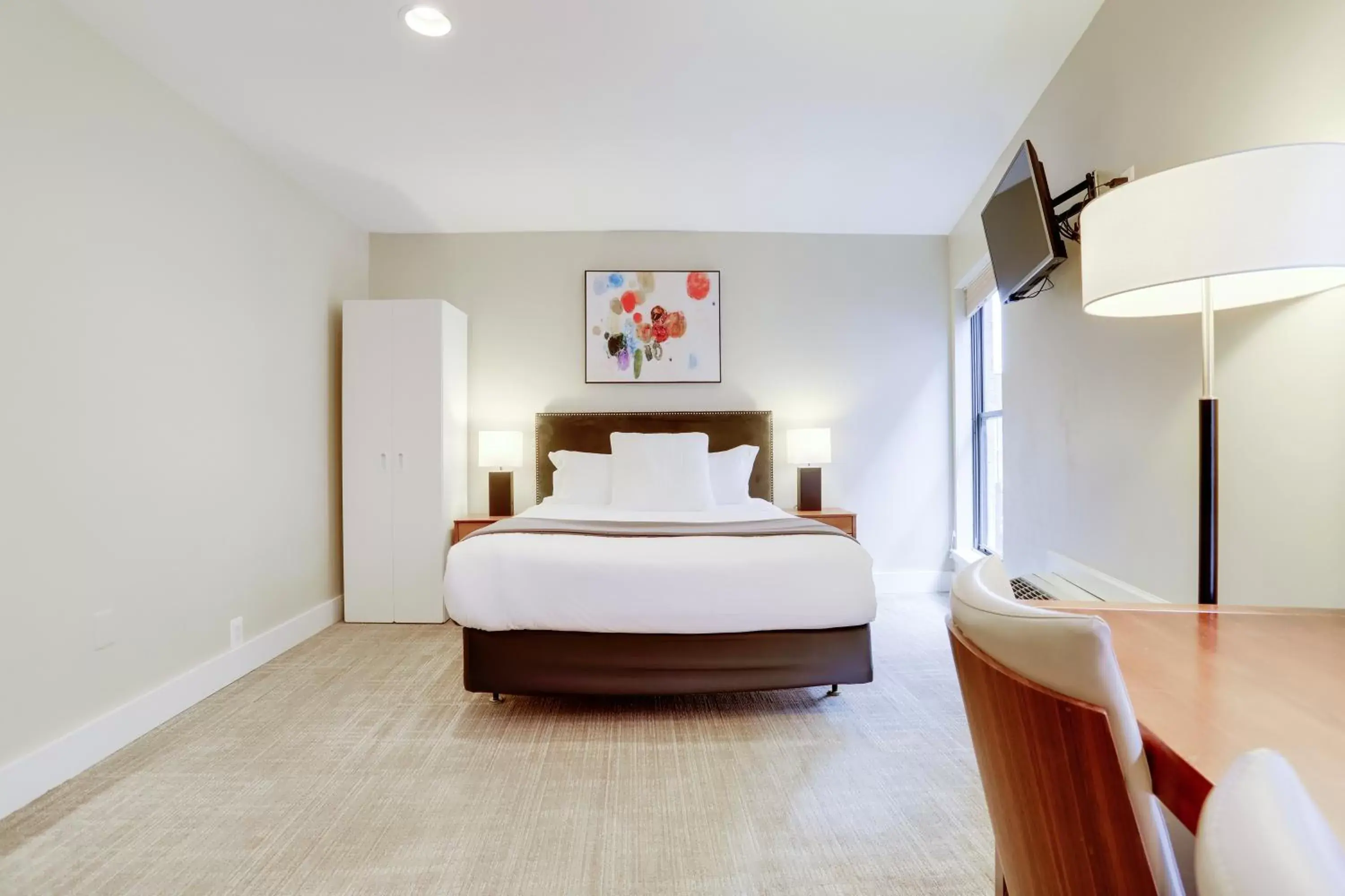 Bed in Sojourn at DuPont Place