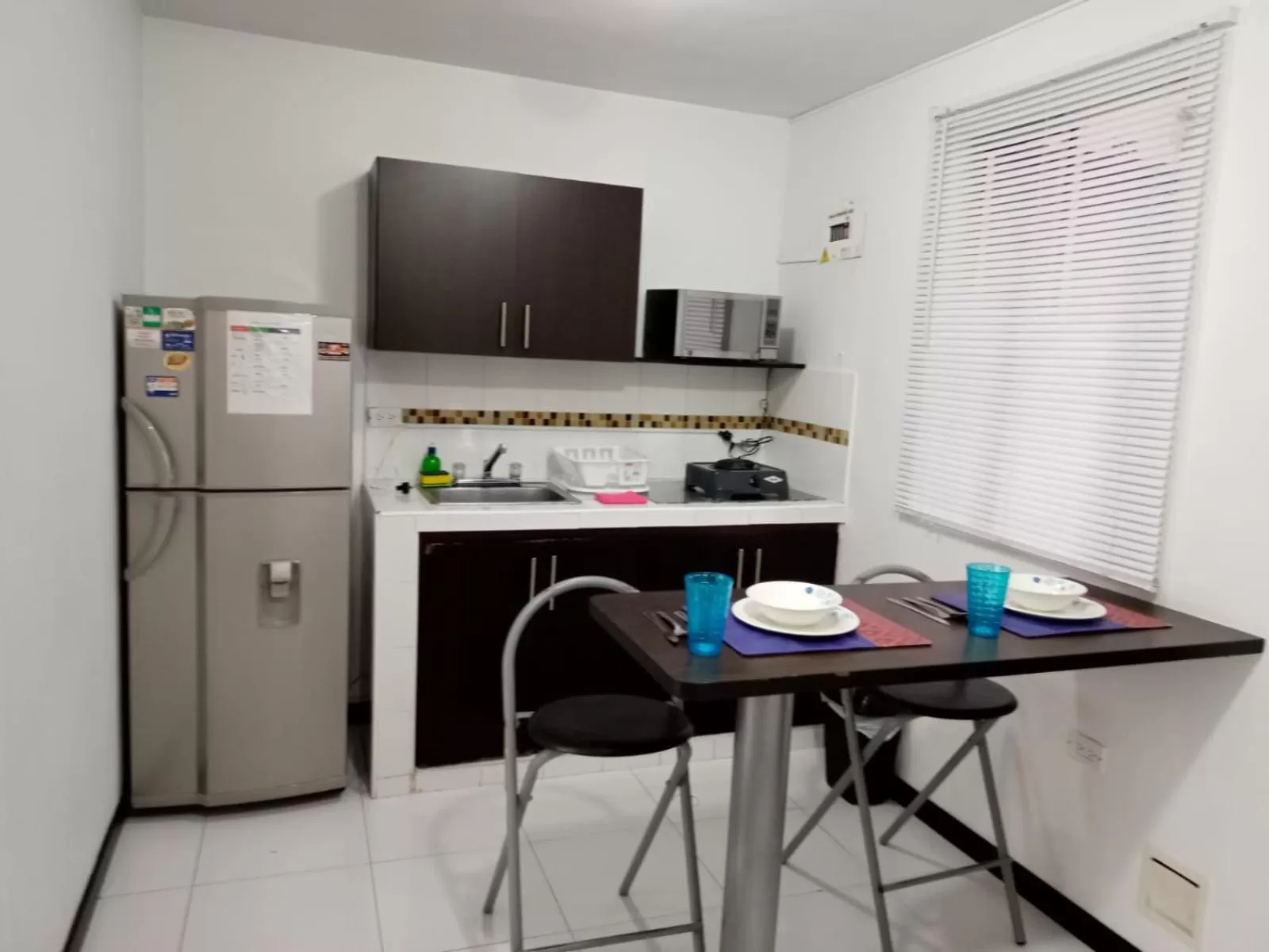 Kitchen or kitchenette in Apartasuites San Marcos