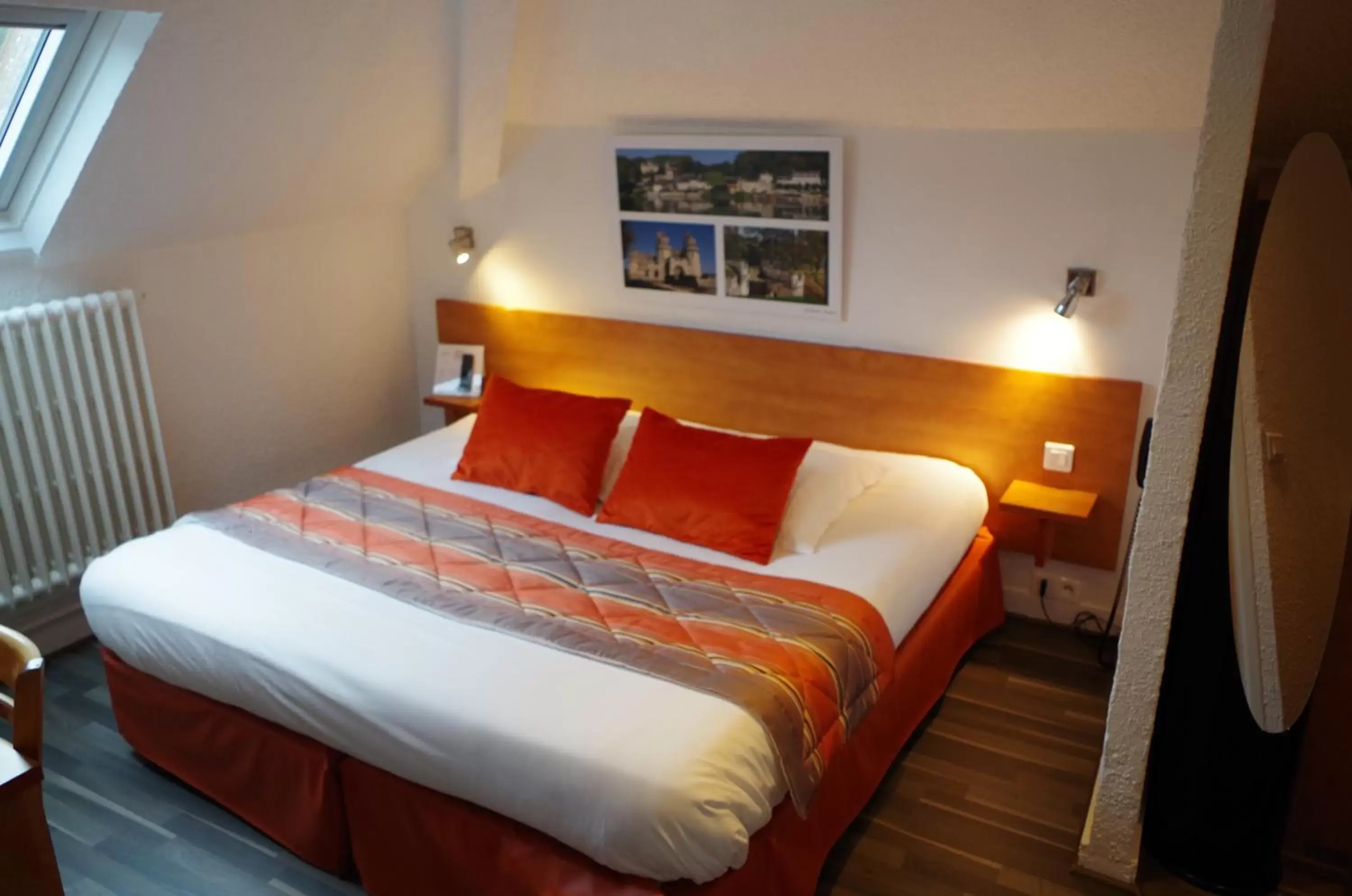 Bed in Logis Hotel Beaudon
