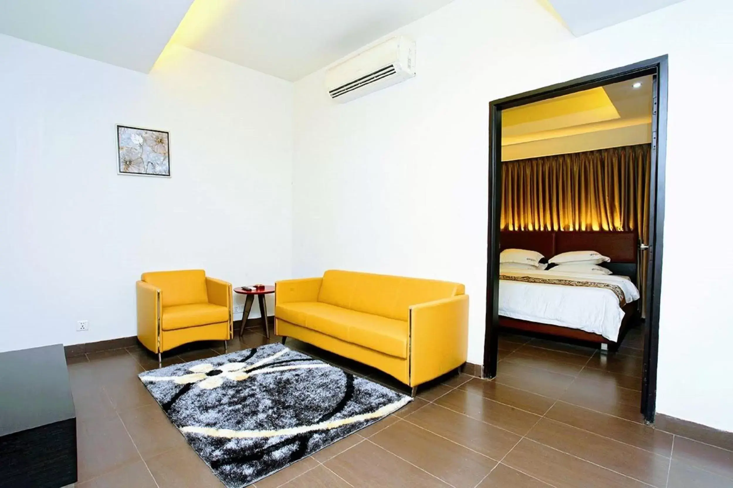 Seating area, Bed in Galesia Hotel & Resort - DHAKA Seating area, Bed in Galesia Hotel & Resort - DHAKA