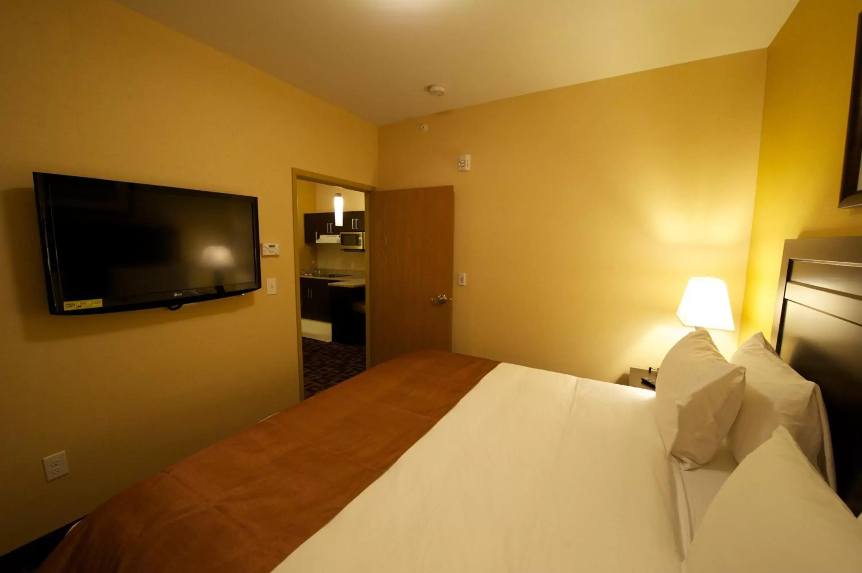 Bed in Days Inn & Suites by Wyndham Winnipeg Airport Manitoba