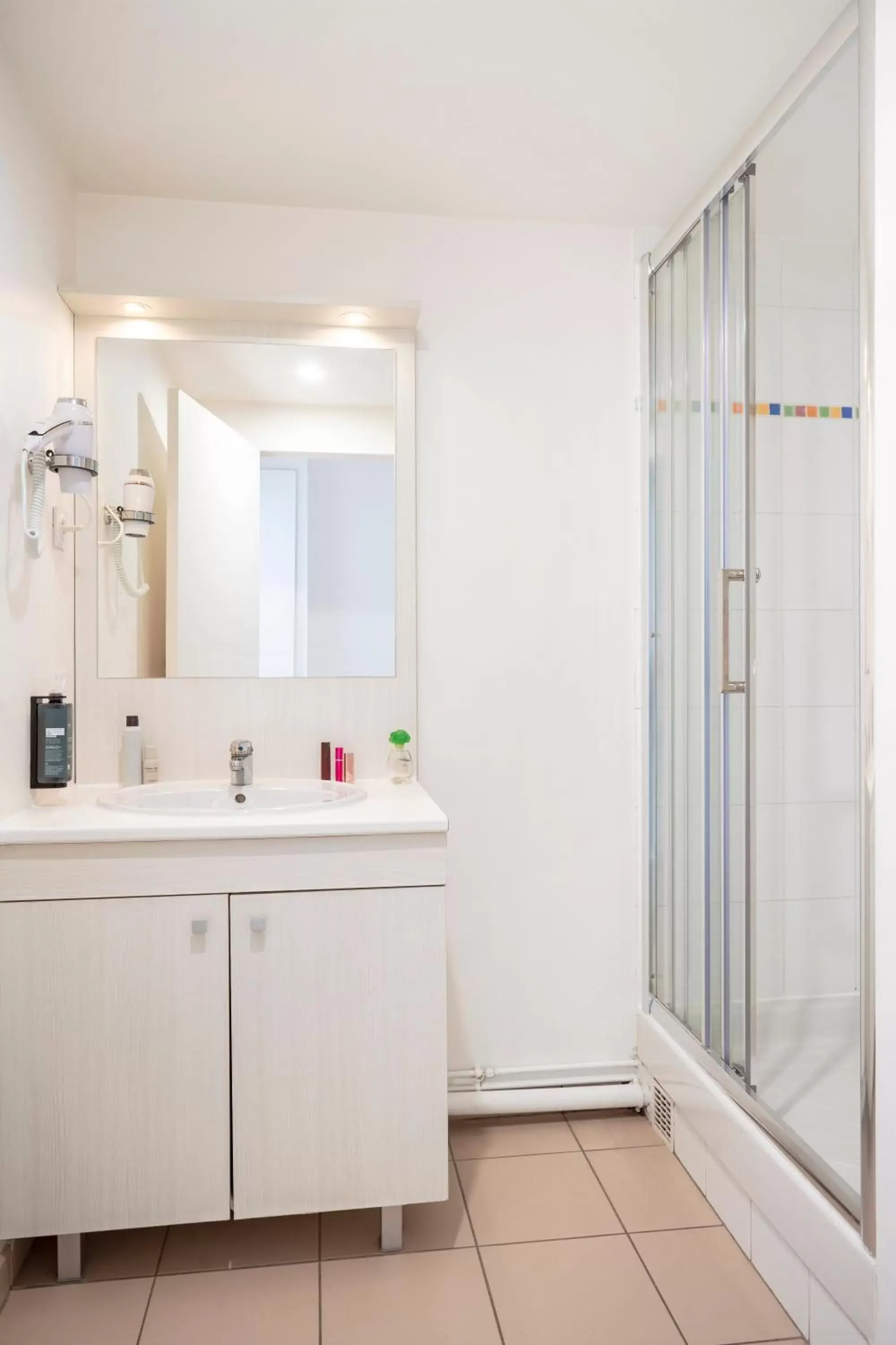 Shower, Bathroom in Séjours & Affaires Paris Vincennes