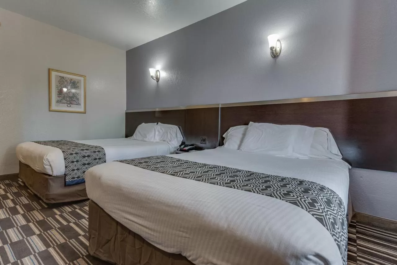 Bed in Microtel Inn & Suites by Wyndham Oklahoma City Airport