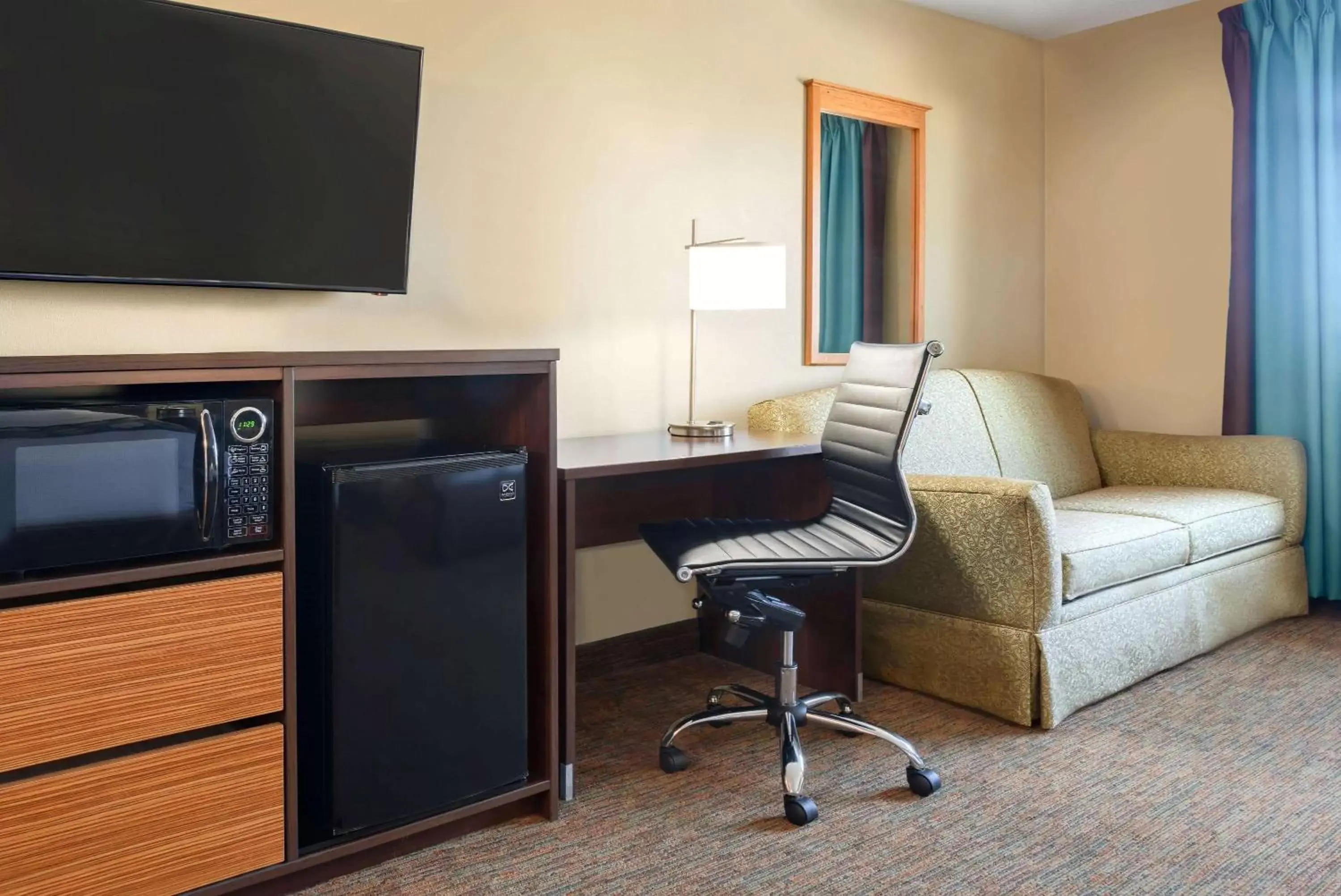 Photo of the whole room, TV/Entertainment Center in Super 8 by Wyndham Sioux Falls