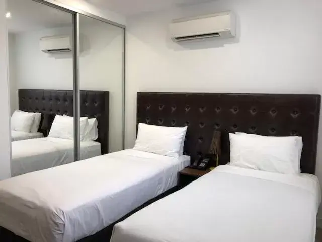 Bed in Whitehorse Apartments Hotel