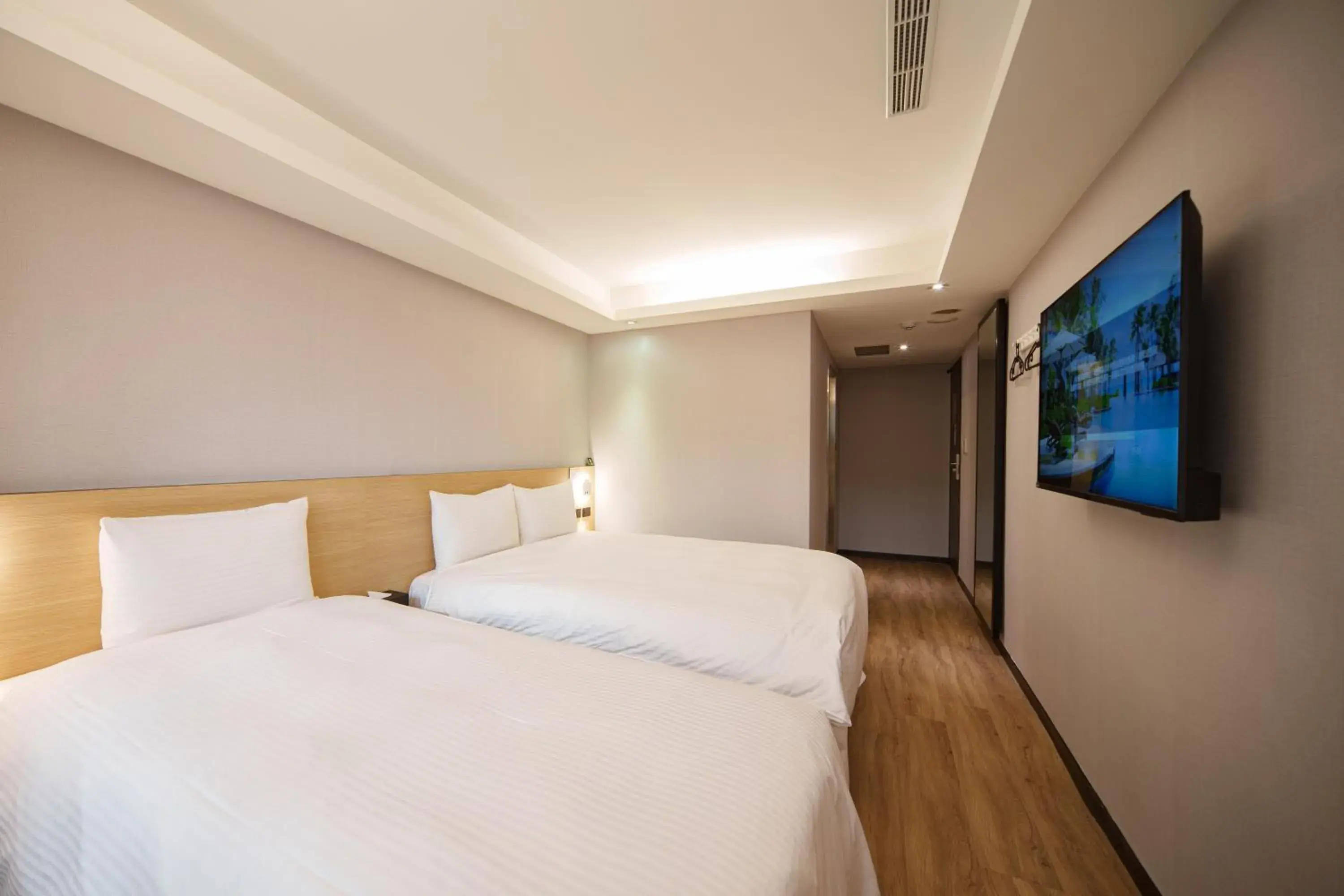 Bed in Hub Hotel Tucheng