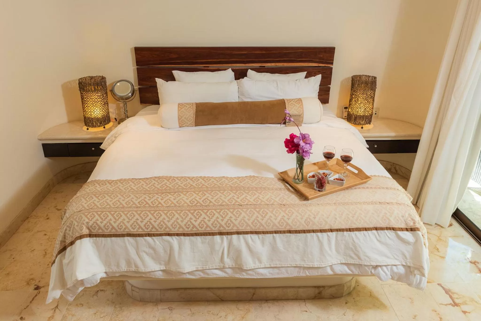 Bed in El Taj Oceanfront and Beachside Condo Hotel